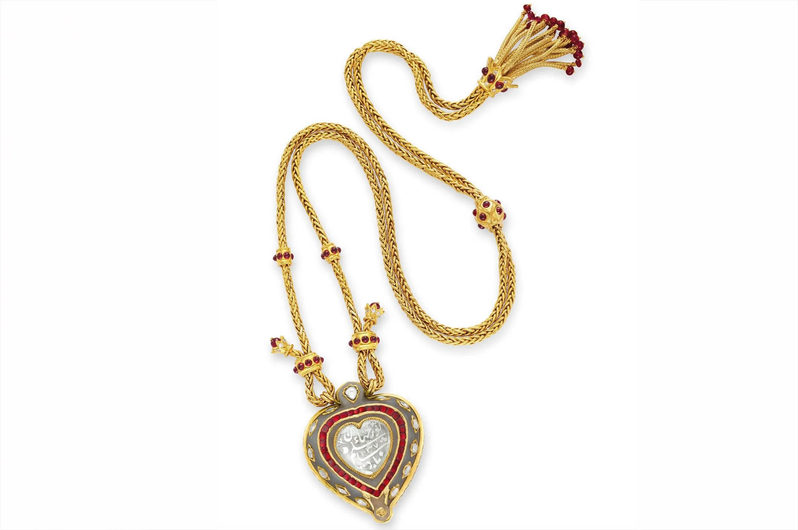 The Taj Mahal Necklace by Cartier, centred on an Indian diamond and jade heart-shaped pendant, suspended from a ruby-set gold chain. Once part of Elizabeth Taylor’s legendary jewellery collection.