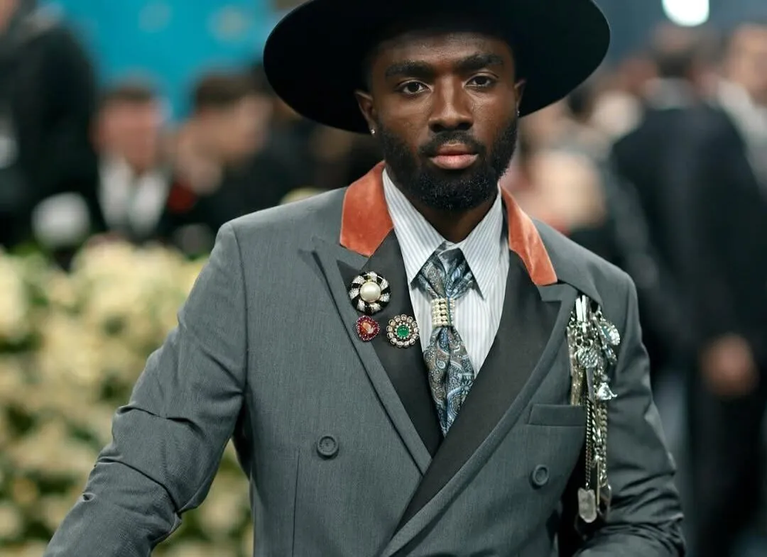 <p>Caleb McLaughlin also piled on the brooches: a trip of vintage designs from Joseph Saidian and Sons</p>
