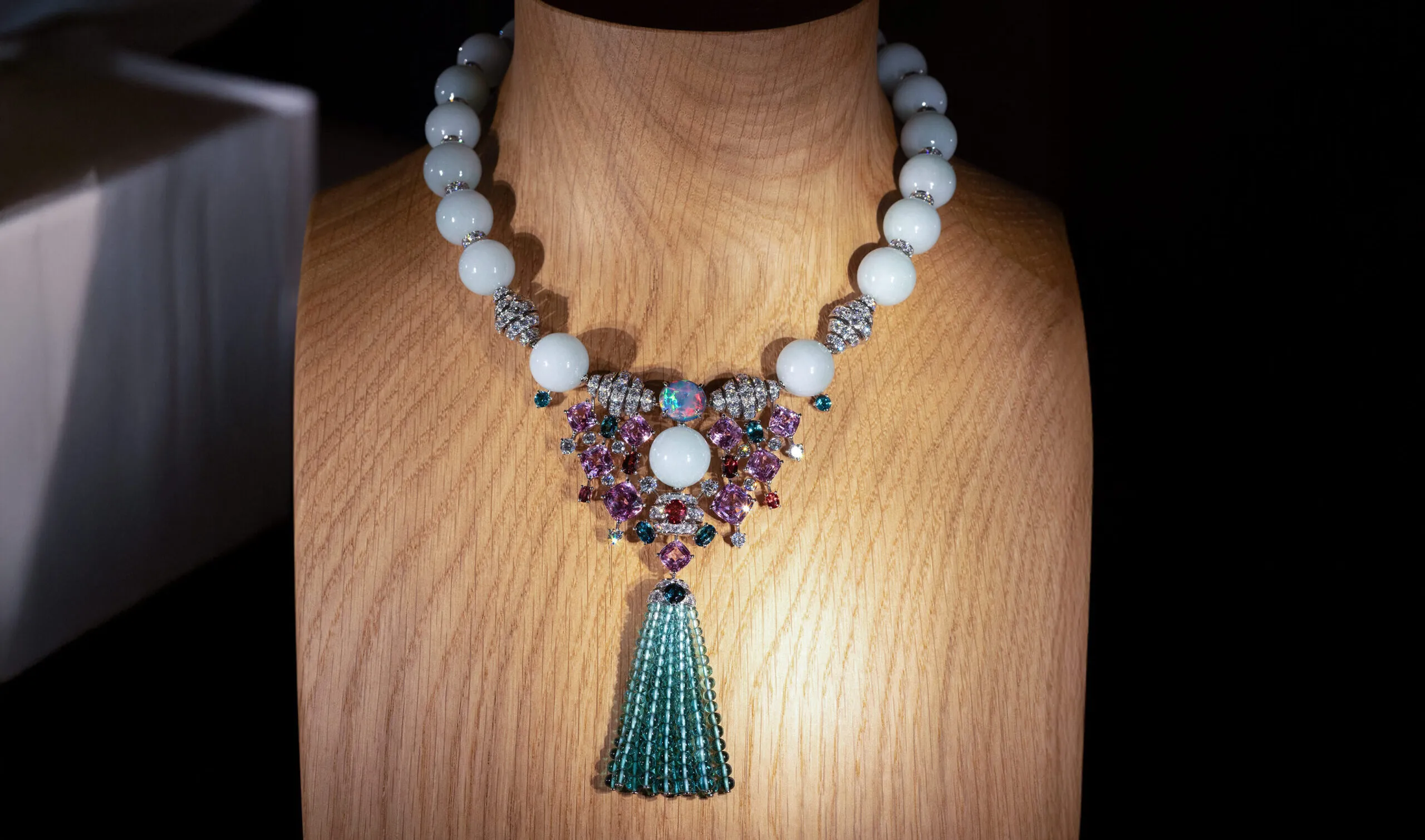 <p>Cartier necklace with 9 cushion-shaped brilliant and step-cut spinels totalling 20.41 carats, a 4.48-carat black opal, jade beads, oval-shaped spinels, oval- and cushion-shaped tourmalines, tourmaline beads, cushion-cut diamonds and brilliant-cut diamonds, set in platinum, part of the En Équilibre High Jewellery collection</p>