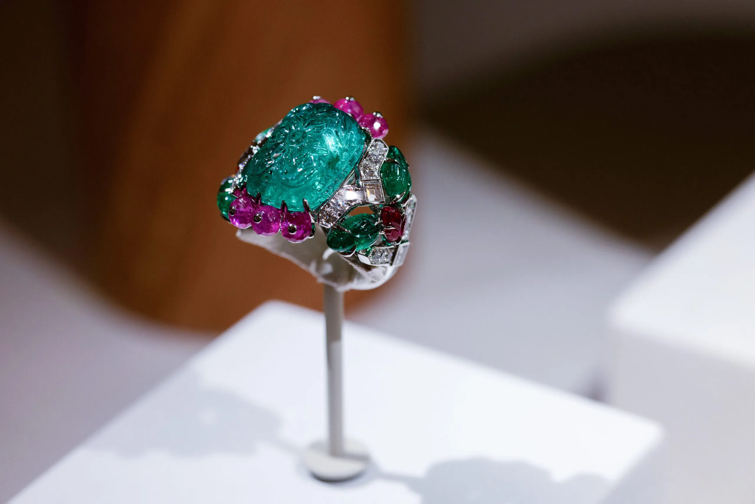 <p>Cartier ring with a 10.99-carat carved emerald, carved emerald leaves, ruby beads and leaves, square-shaped diamonds and brilliant-cut diamonds, set in platinum, part of the En Équilibre High Jewellery collection</p>