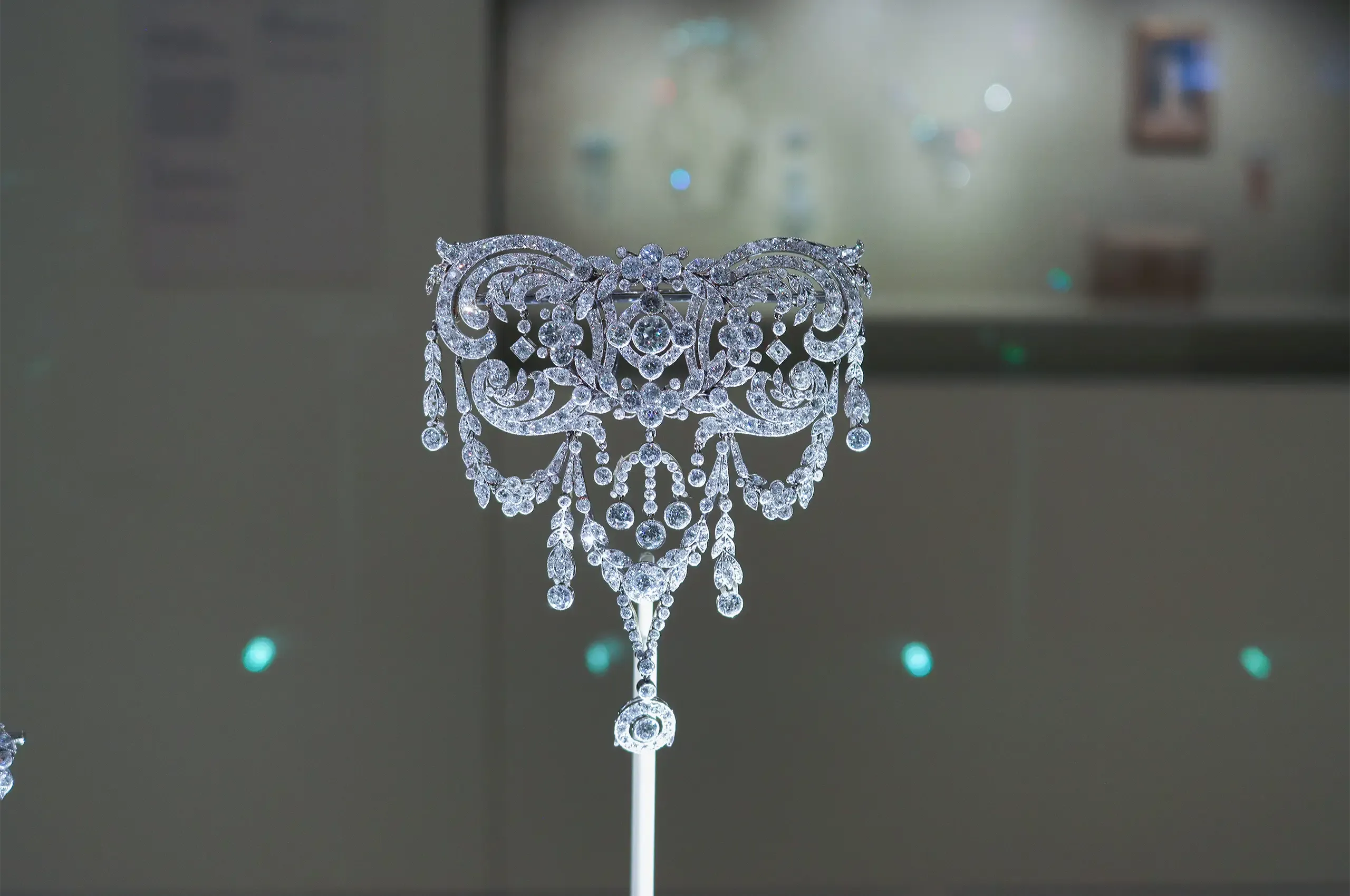 Cartier stomacher brooch, 1909, a special order in platinum and diamonds, designed as an elaborate arrangement of scrolling foliage, flowers, garlands and pendant drops. Cartier Collection.