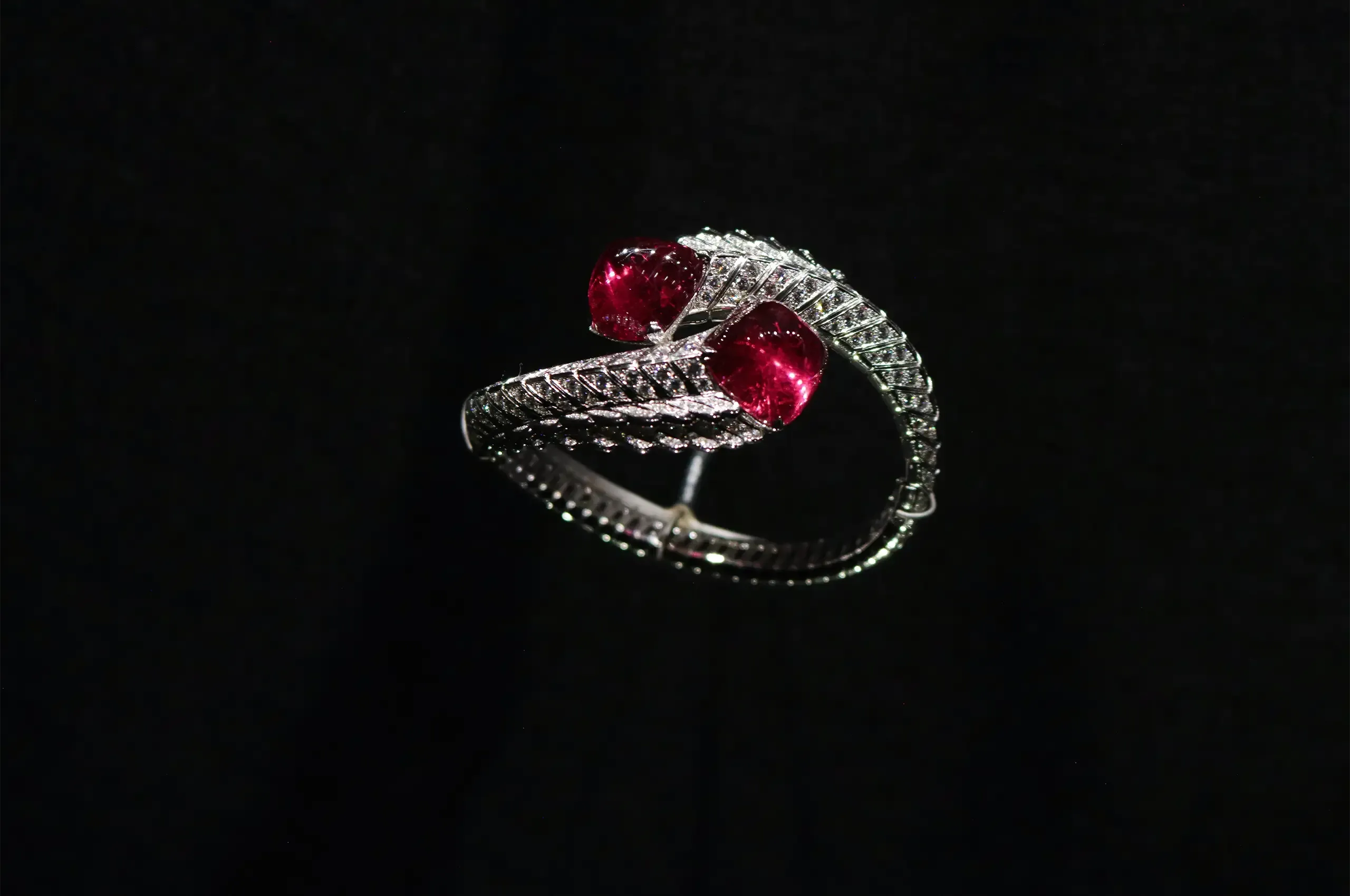 Cartier Quetzal bracelet, 2016, with two sugarloaf rubellites totalling 41.09 carats, black lacquer and diamonds