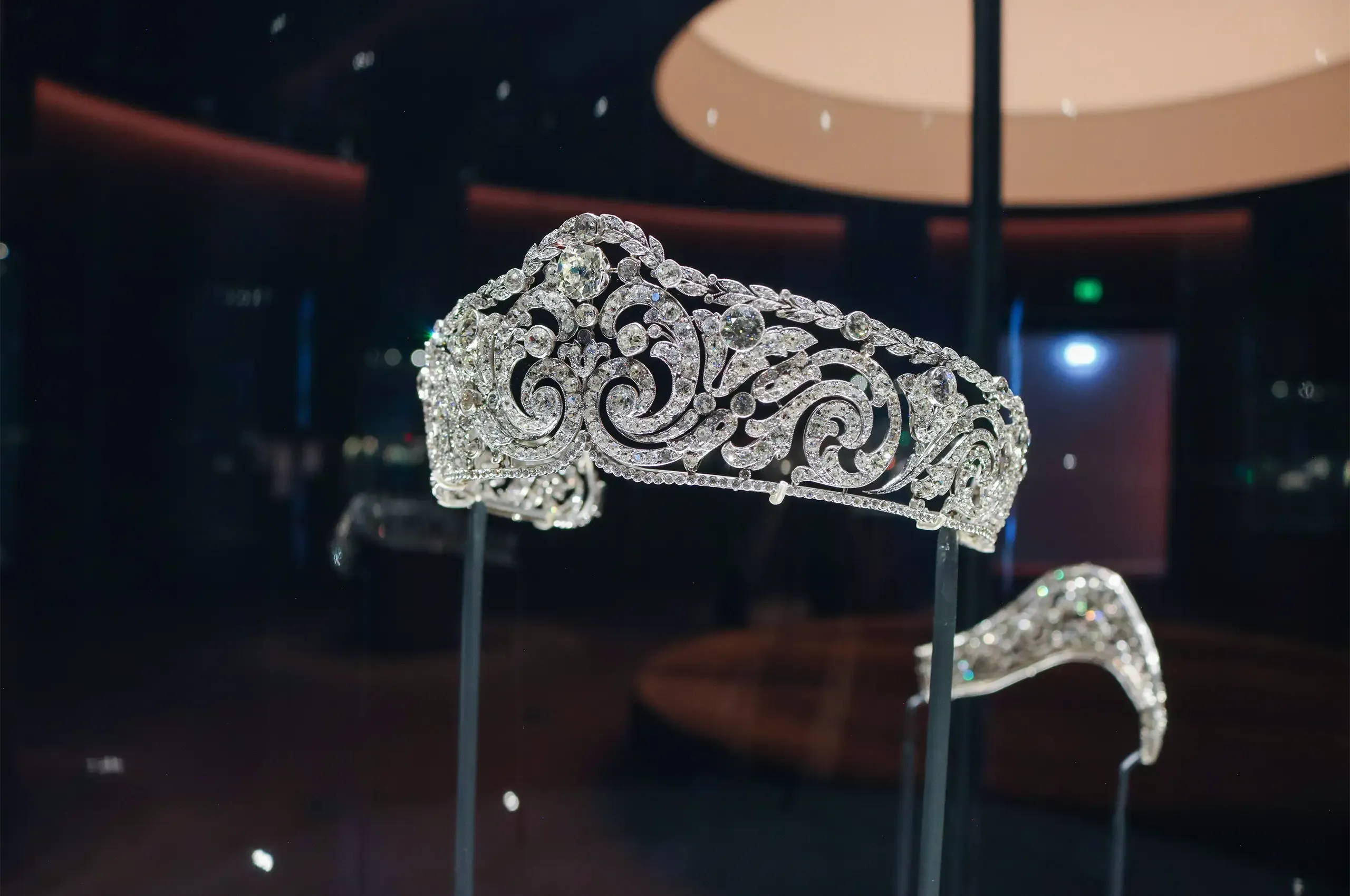 Cartier Scroll tiara, 1910, in platinum and diamonds, its symmetrical scrolling motifs culminating in a cushion-shaped diamond. Cartier Collection