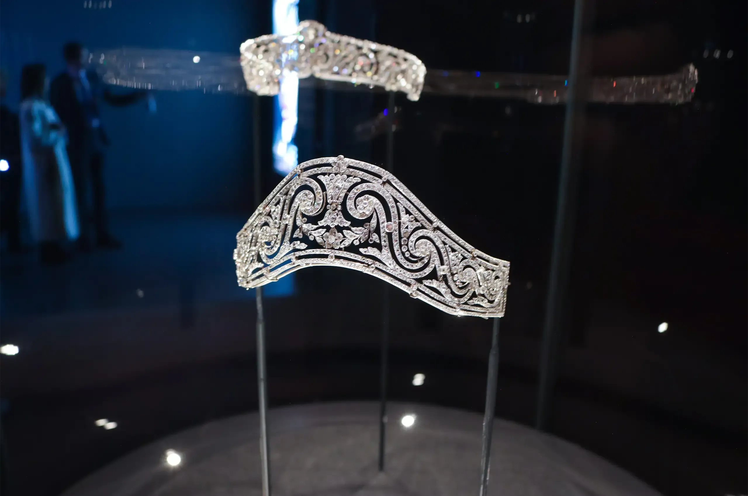 Cartier tiara, 1911, in platinum and diamonds, its interlocking scrolls and floral motifs inspired by 18th-century Parisian ironwork. Cartier Collection