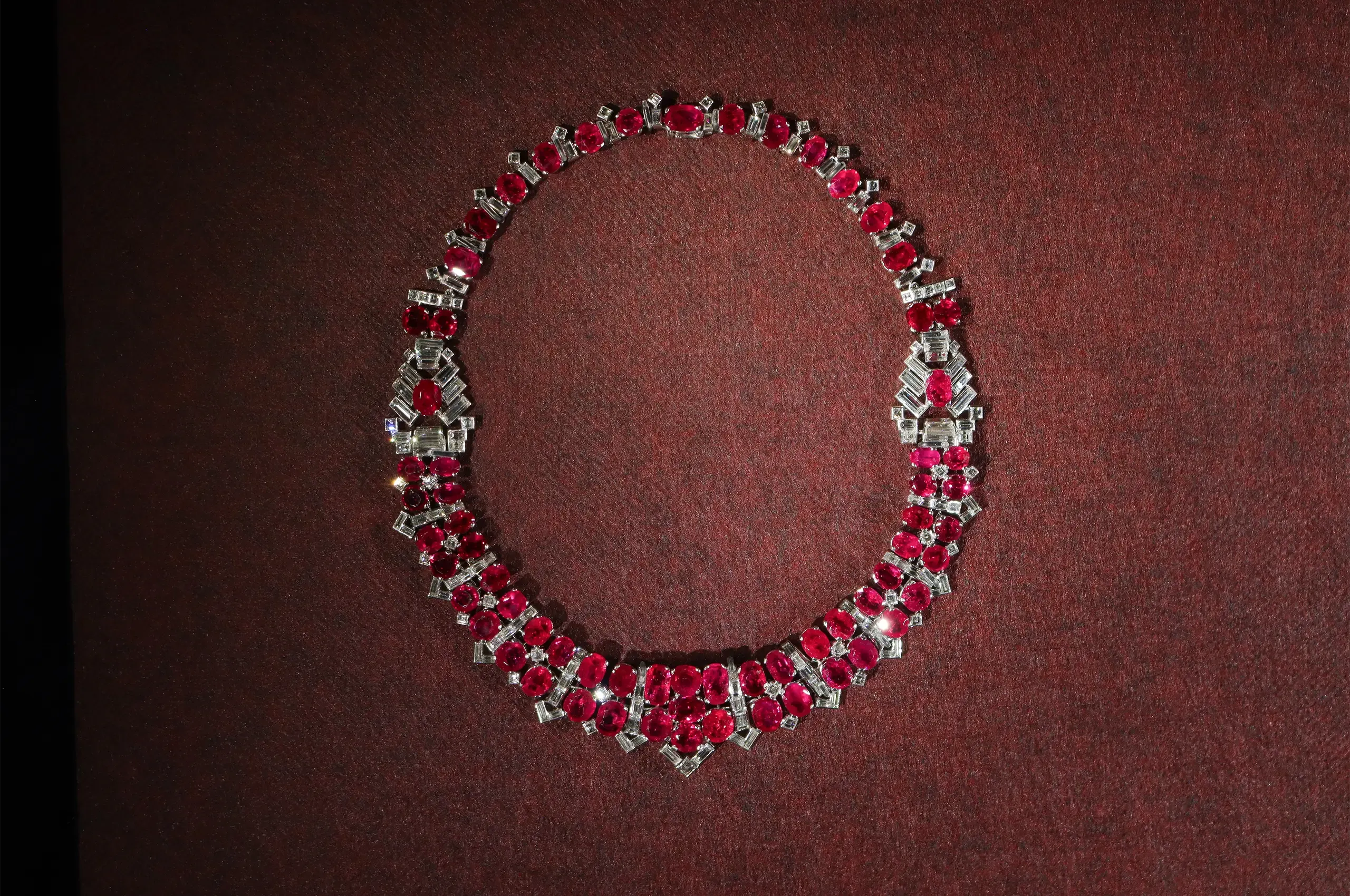 Cartier necklace, 1951, a special order set with Burmese rubies and diamonds, with five detachable motifs that can be worn as brooches. Cartier Collection