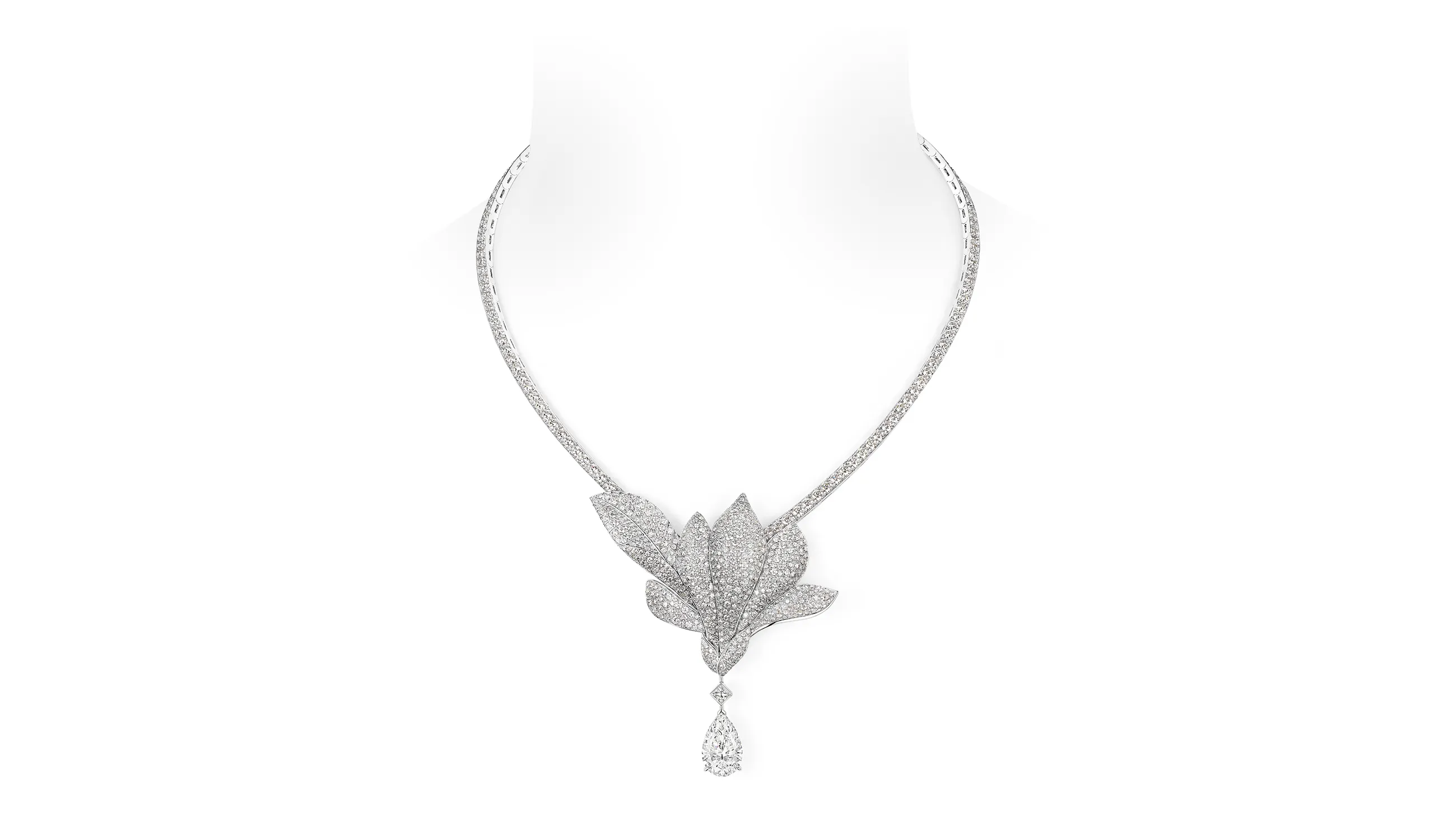 <p>A minimalist bloom punctuates the neckline of the Magnolia Grandiflora necklace, with a remarkable 5.26-carat D Flawless type II pear shape diamond suspended beneath</p>