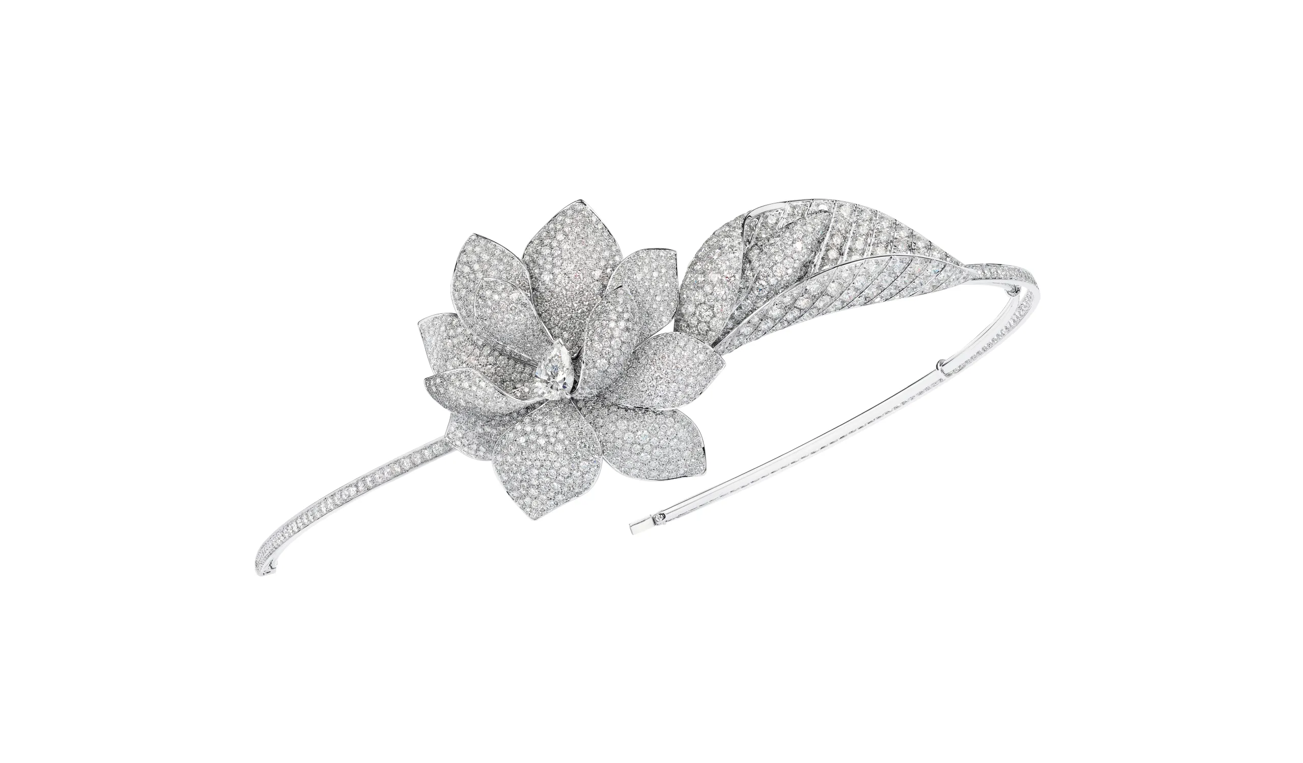 <p>The contemporary Magnolia Grandiflora tiara is designed to be worn off-centre, like a bandeau</p>