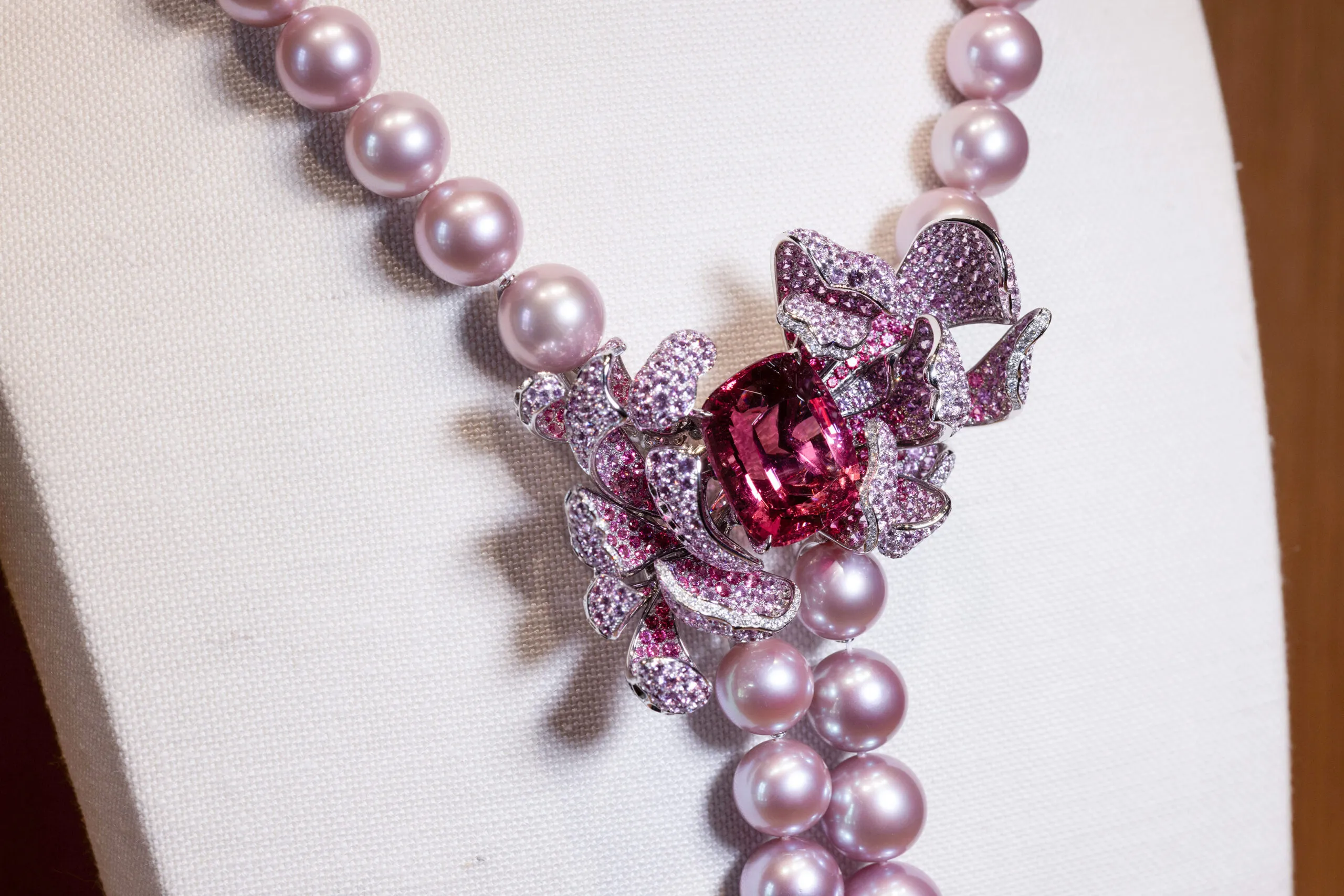 <p>The 44.23 carat cushion-cut spinel is deep pink in hue, shot through with a hint of violet</p>