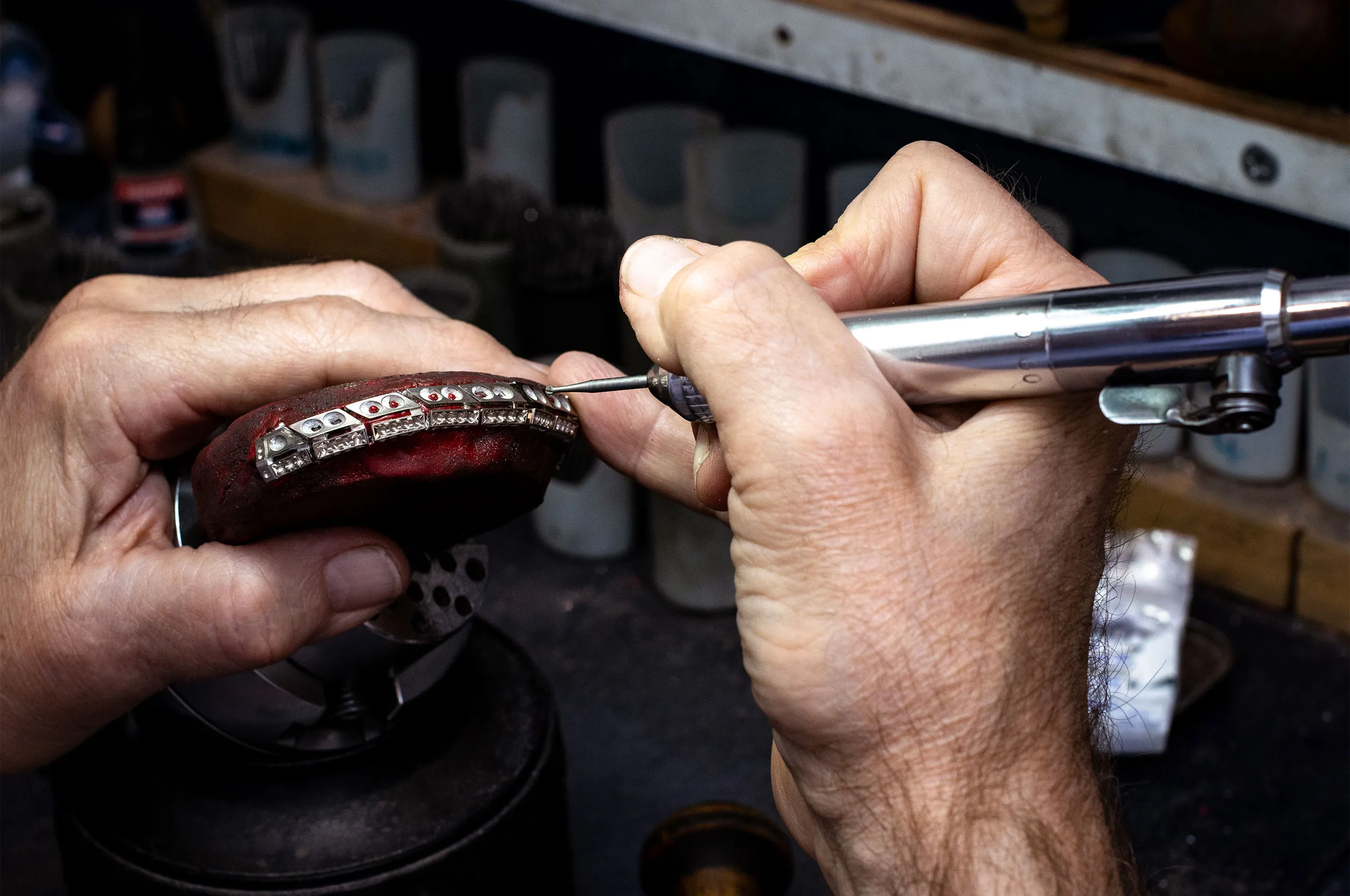 A David Morris craftsman at work on one of the articulated sections of the Gemma necklace