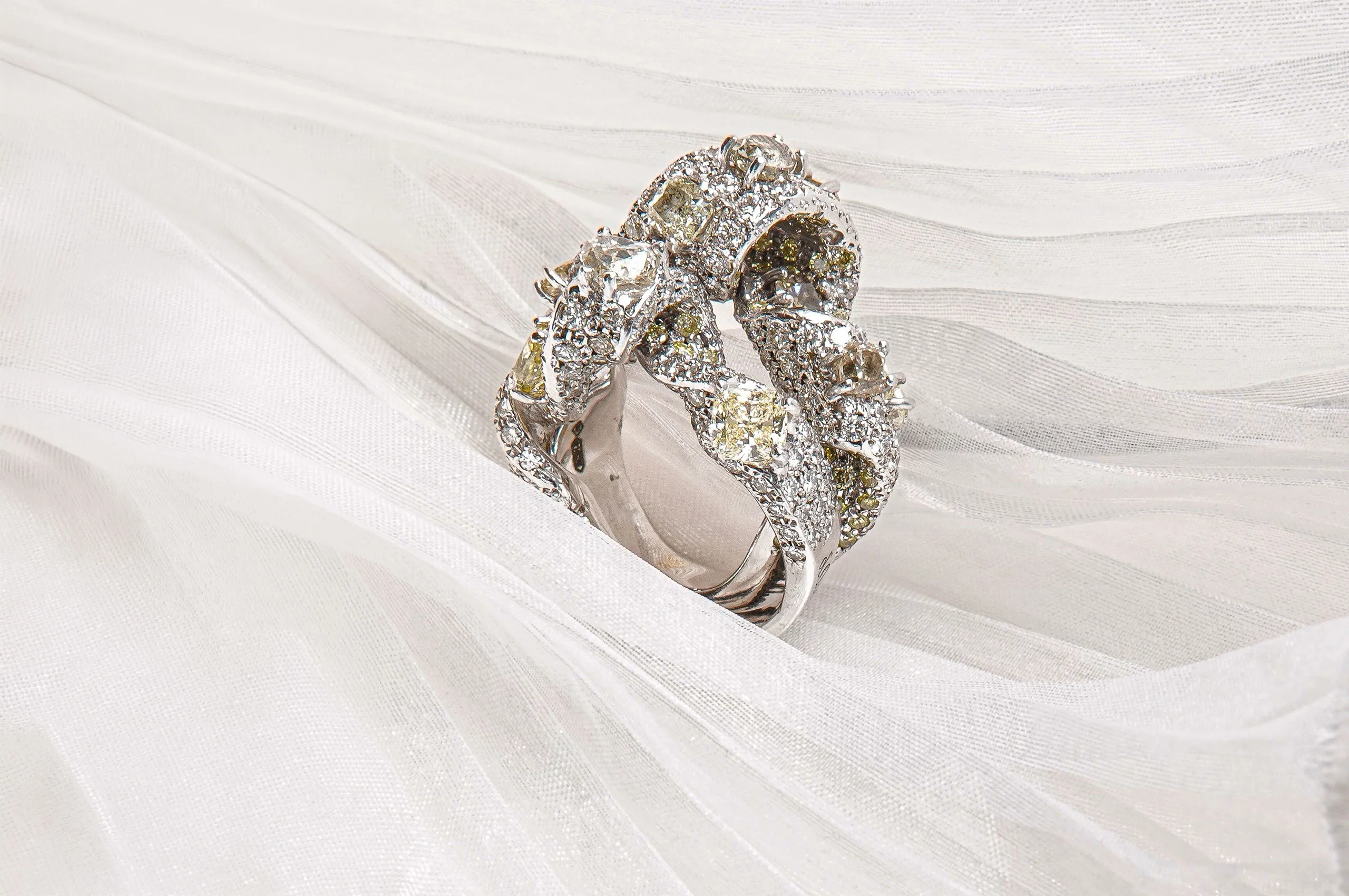 Two complementary d'Avossa rings, to be worn together or separately, featuring ribbons of white gold and natural diamonds