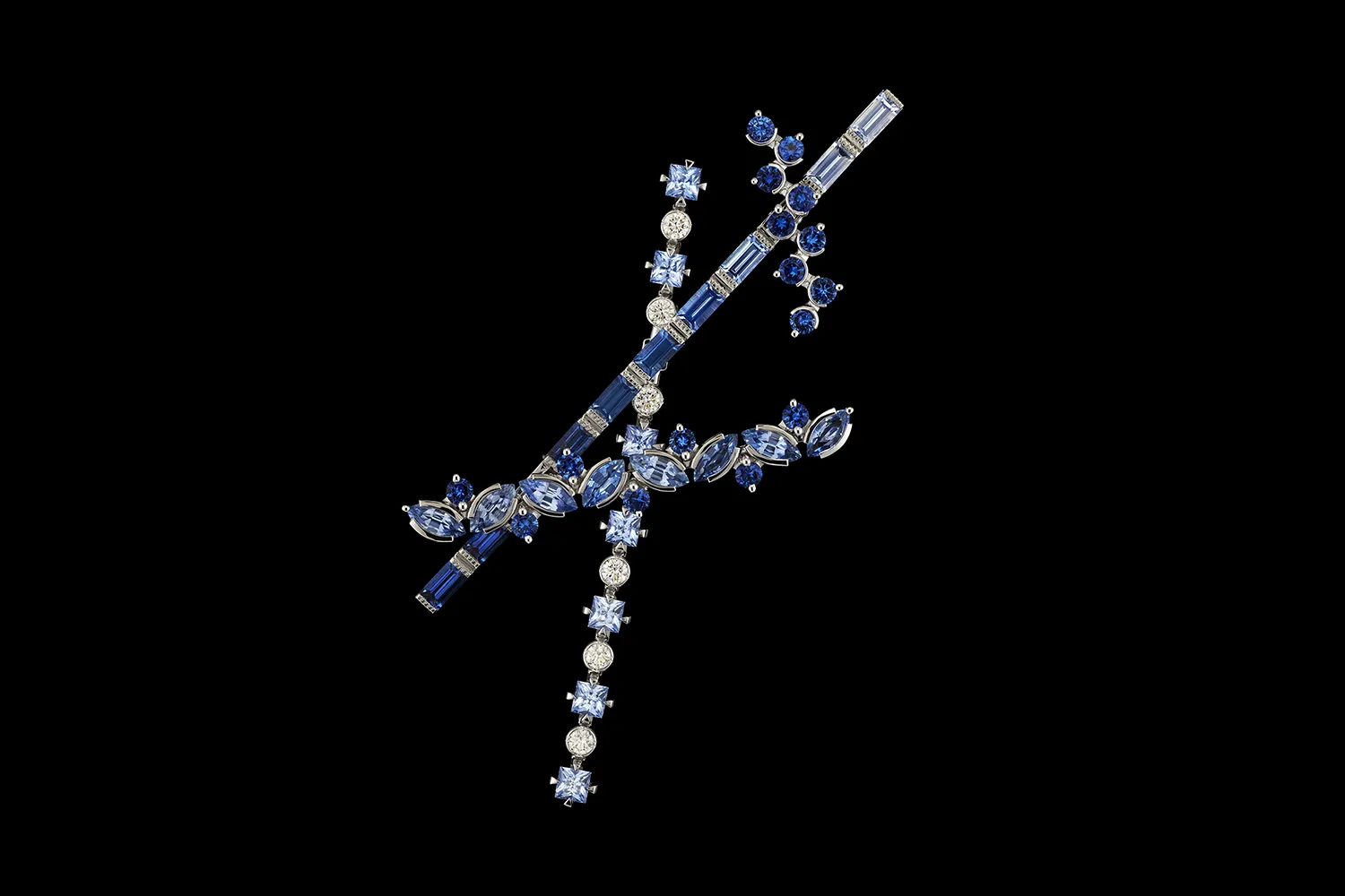 <p>A brooch-pin from the Diorexquis High Jewellery collection with fancy-cut sapphires and diamonds in a gradient of blue hues </p>