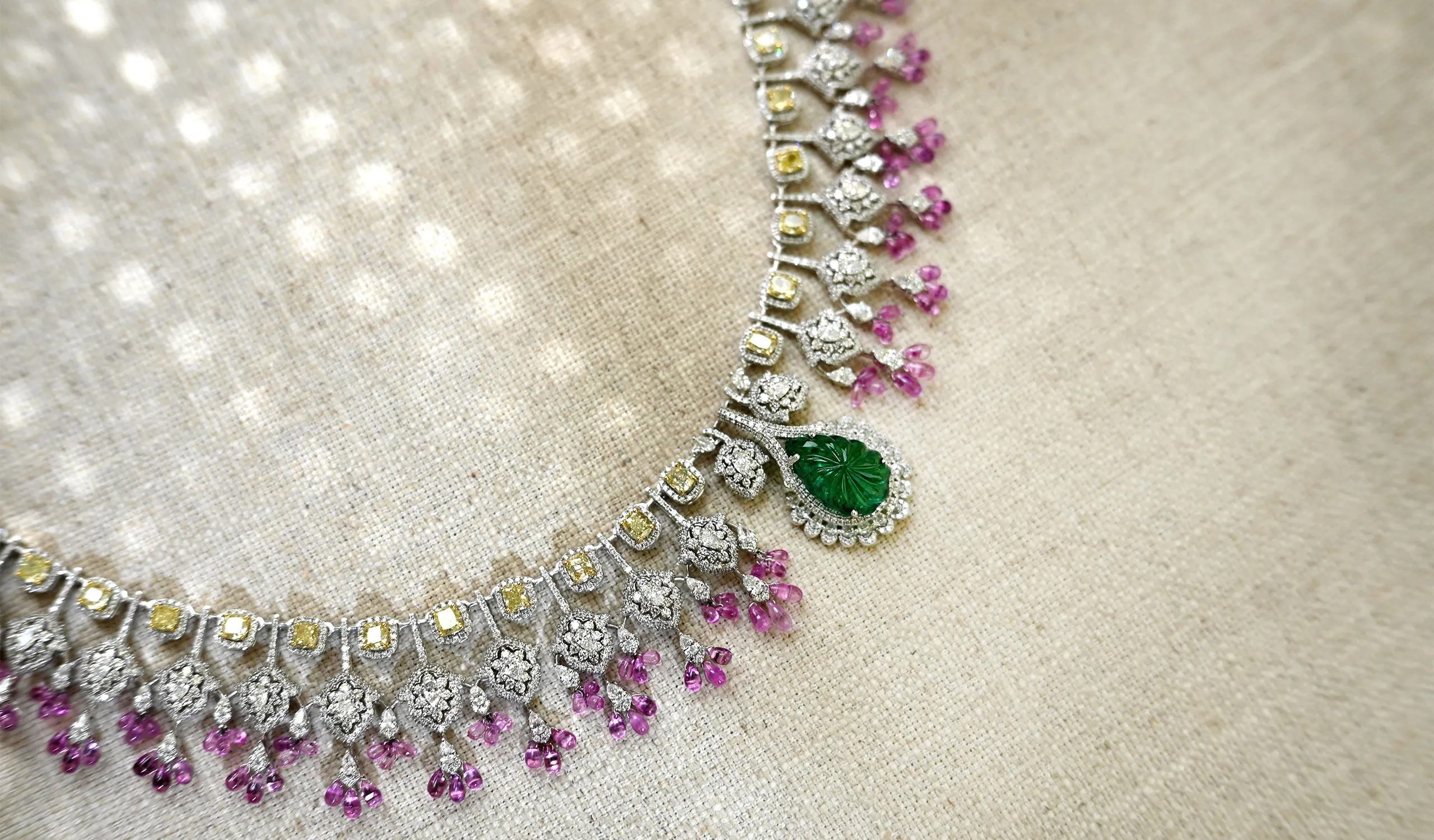 <p>The focal point of this High Jewellery necklace by Diviano is a vibrant carved emerald surrouded by diamonds </p>