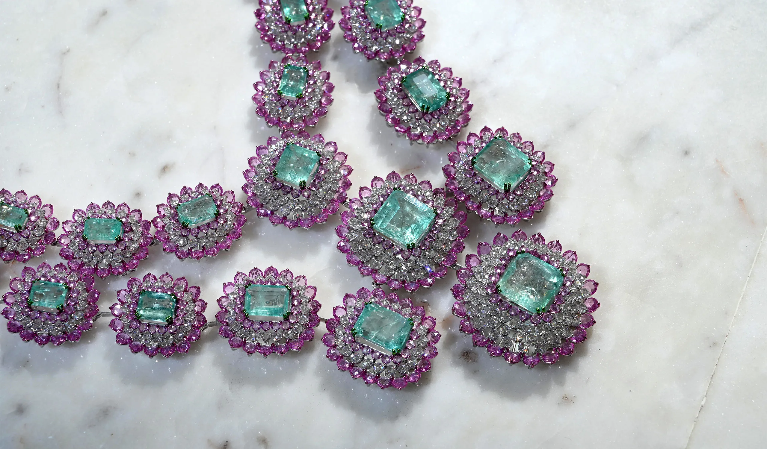 <p>A closer look at a masterpiece necklace by Diviano, crafted with old Russian emeralds, diamonds, and pink sapphires in 18k white gold, part of the Diviano One Collection</p>