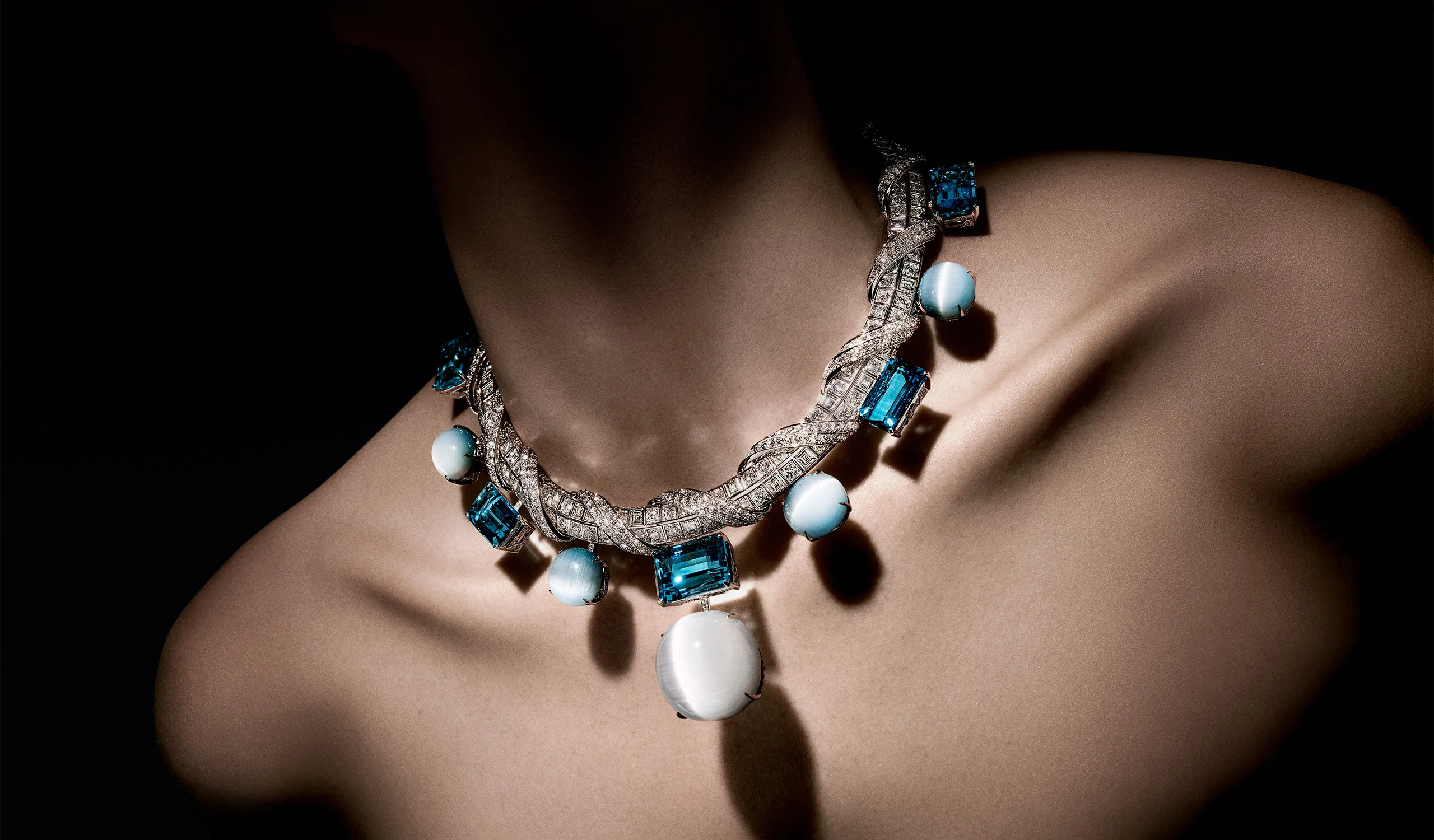 <p>Diamonds twist around the necklace in ribbons, overlaying Louis Vuitton’s signature Damier (checkerboard) pattern</p>

