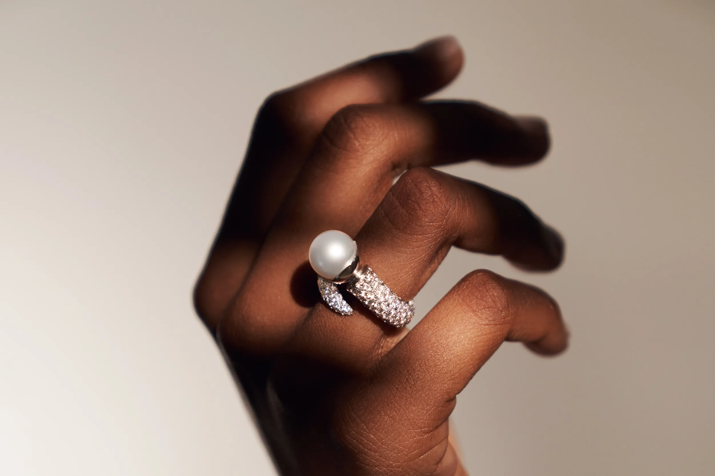 <p>A model wears the El&#8217;eeté Jewellery South Sea pearl ring from Collection №1 with 300 brilliant-cut white diamonds totalling 3.9 carats and an 11mm pearls set in 18k white gold </p>
