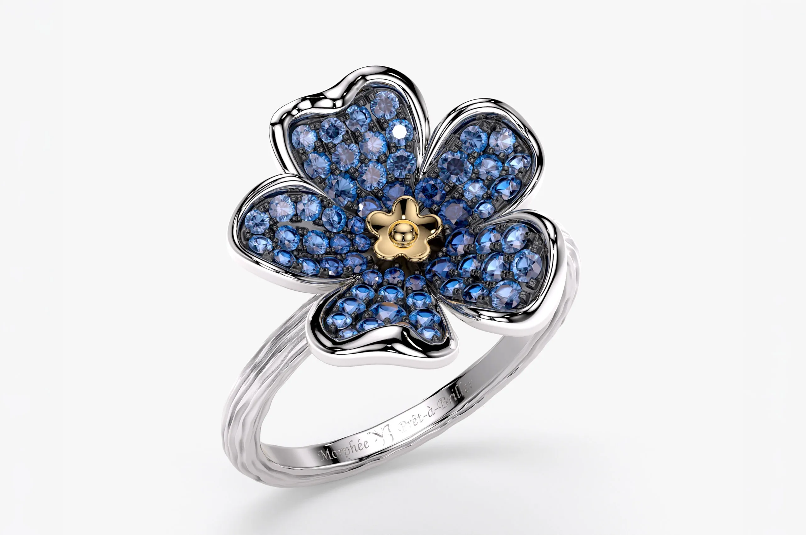 Prêt-à-Briller Large Forget-Me-Not ring in 9k white and yellow gold set with 0.85 carats of blue sapphires
