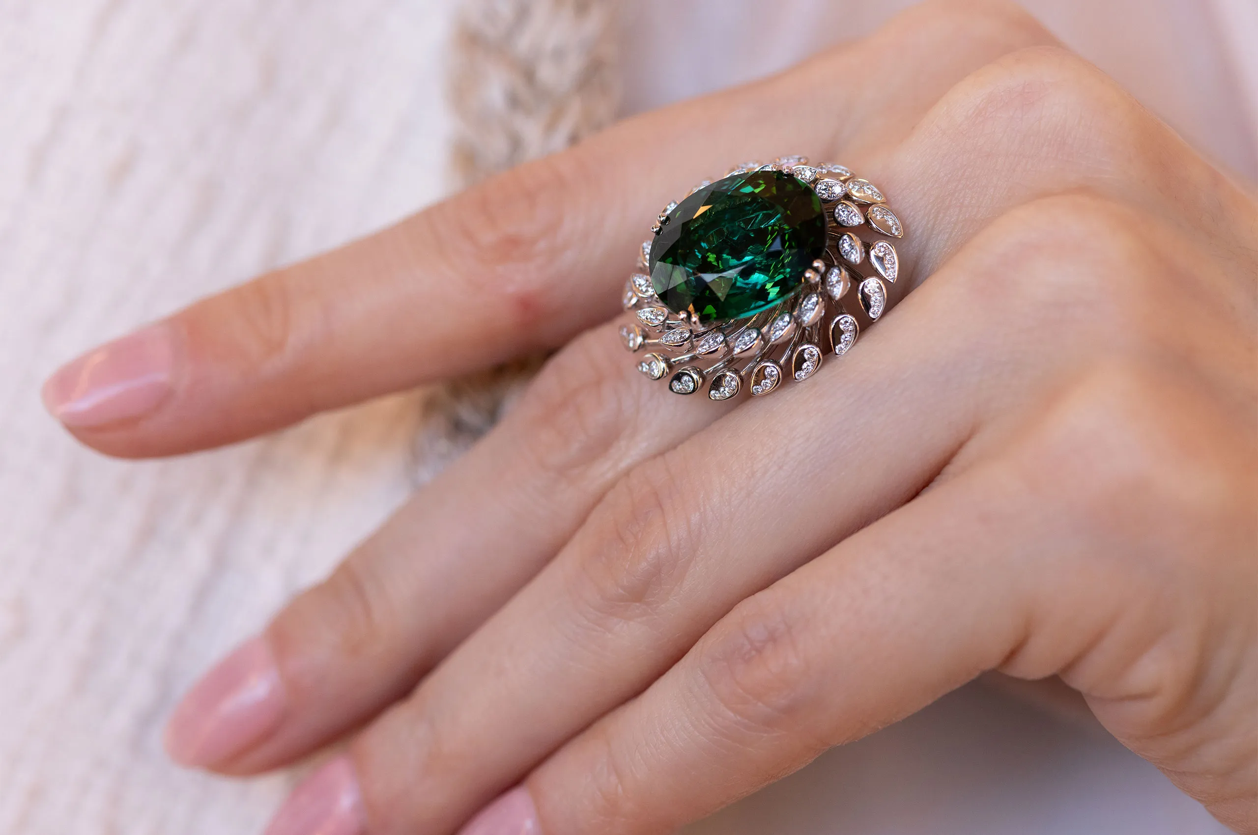 A closer look at the intricate diamond setting on a ring by Giorgio Visconti, set with an oval-shaped green tourmaline in white gold 