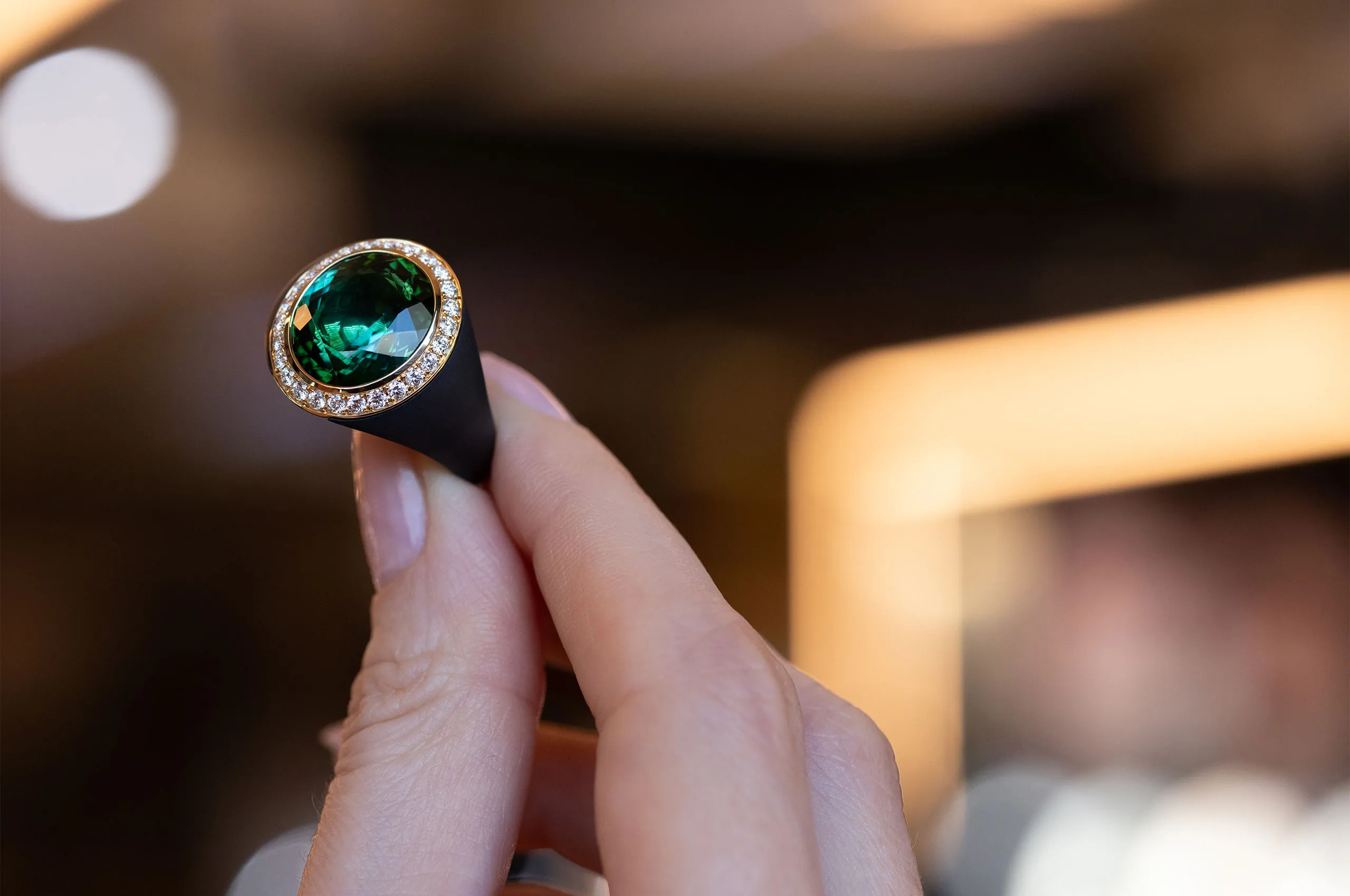 Giorgio Visconti ring set with a central green tourmaline and diamonds in black titanium and rose gold 