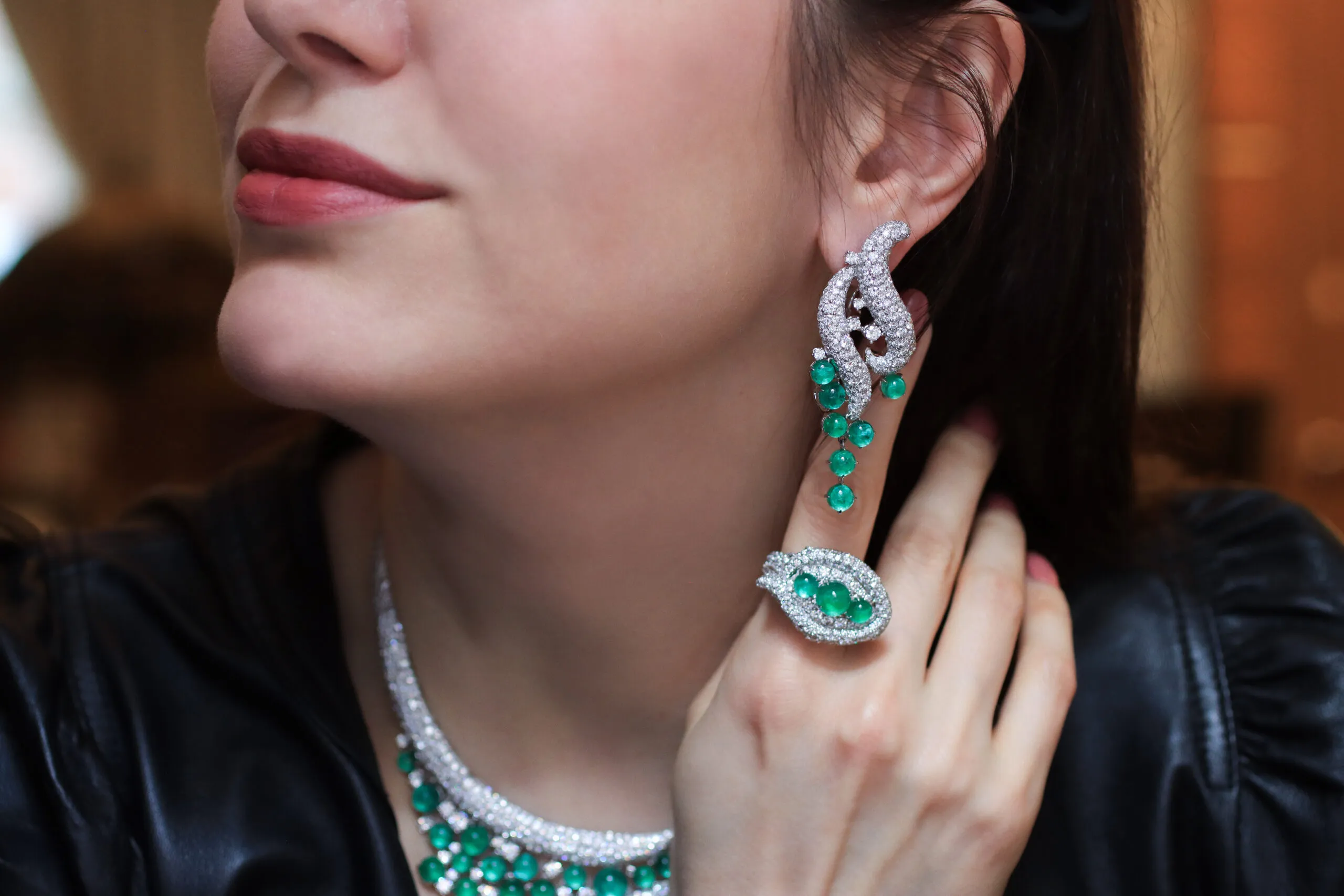 <p>A closer look at the AKANO Mkpulu earrings with 10 carats of diamonds and 13 carats of emeralds, alongside the matching ring with further diamonds and emeralds, both in 18k gold</p>