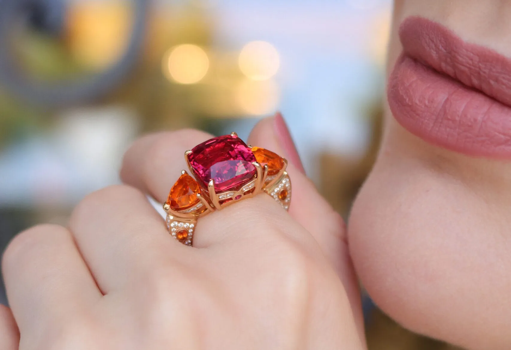 <p>House of Gübelin Classics spinel cocktail ring with a Tanzanian purplish-red spinel of over 9 carats flanked by two mandarin garnets and brilliant-cut diamonds in red gold</p>
