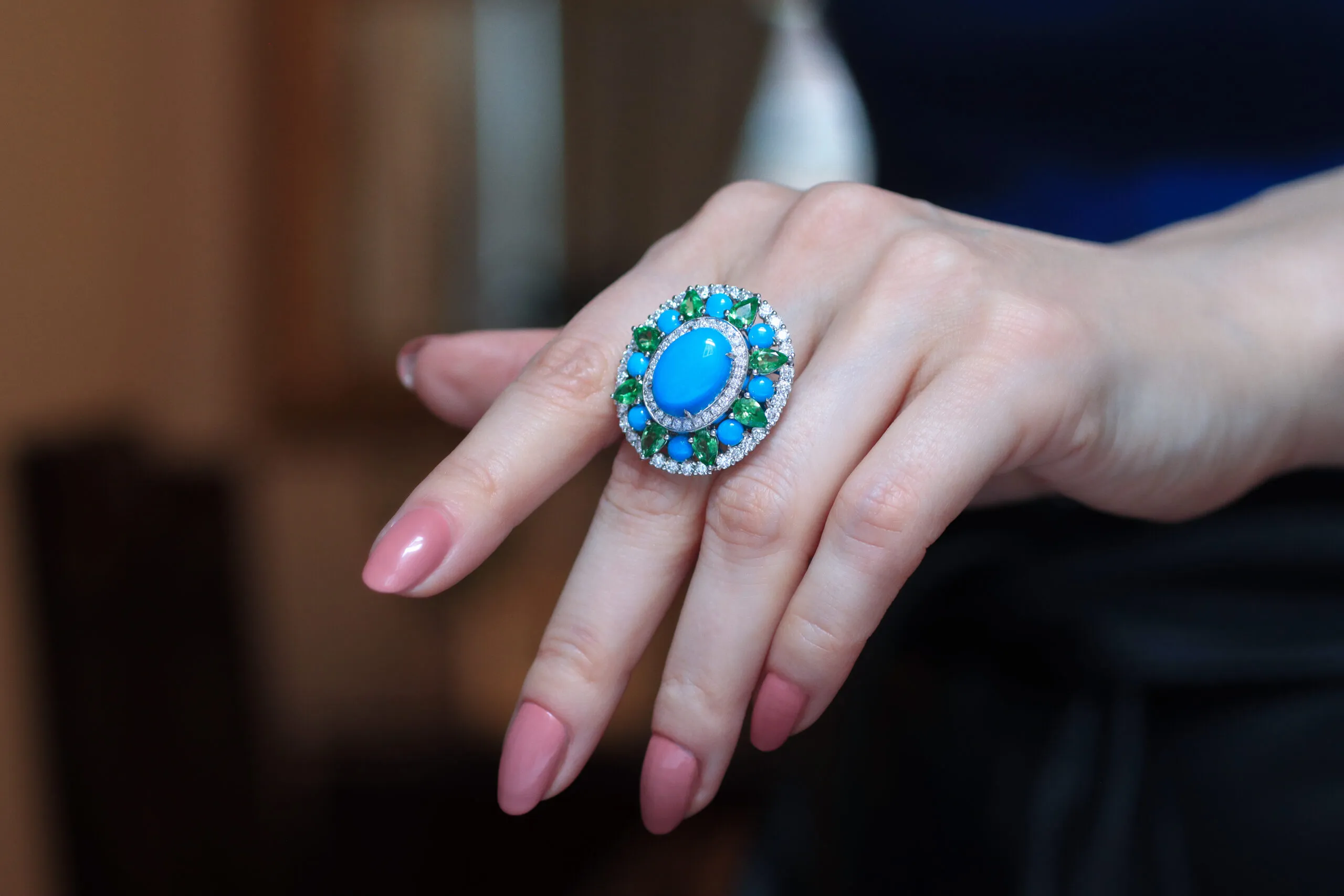 <p>AKANO Chikaodili ring with 2.62 carats of round turquoise, 2.9 carats of tsavorite, 2.4 carats of diamonds, and 6.5 carats of oval-shaped turquoise, set in 18k gold </p>