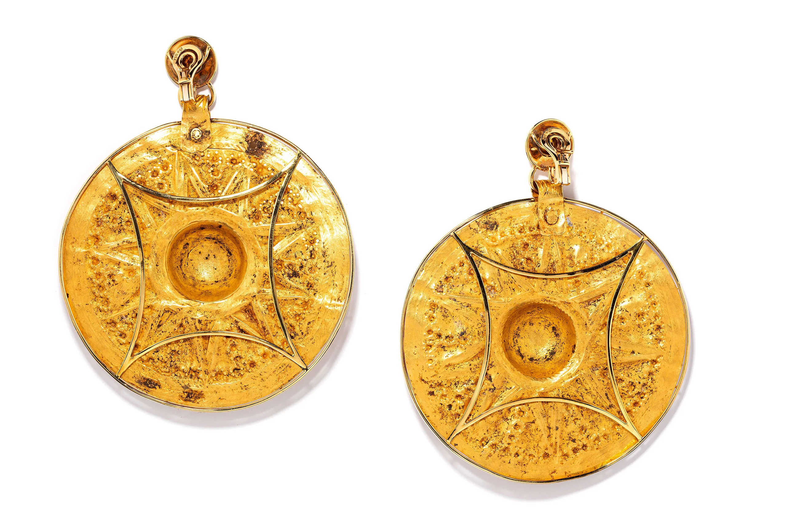 The reverse of the Ziwiye earrings reveals the preserved construction and surface of the ancient gold medallions, offering a closer view of their original workmanship and age.