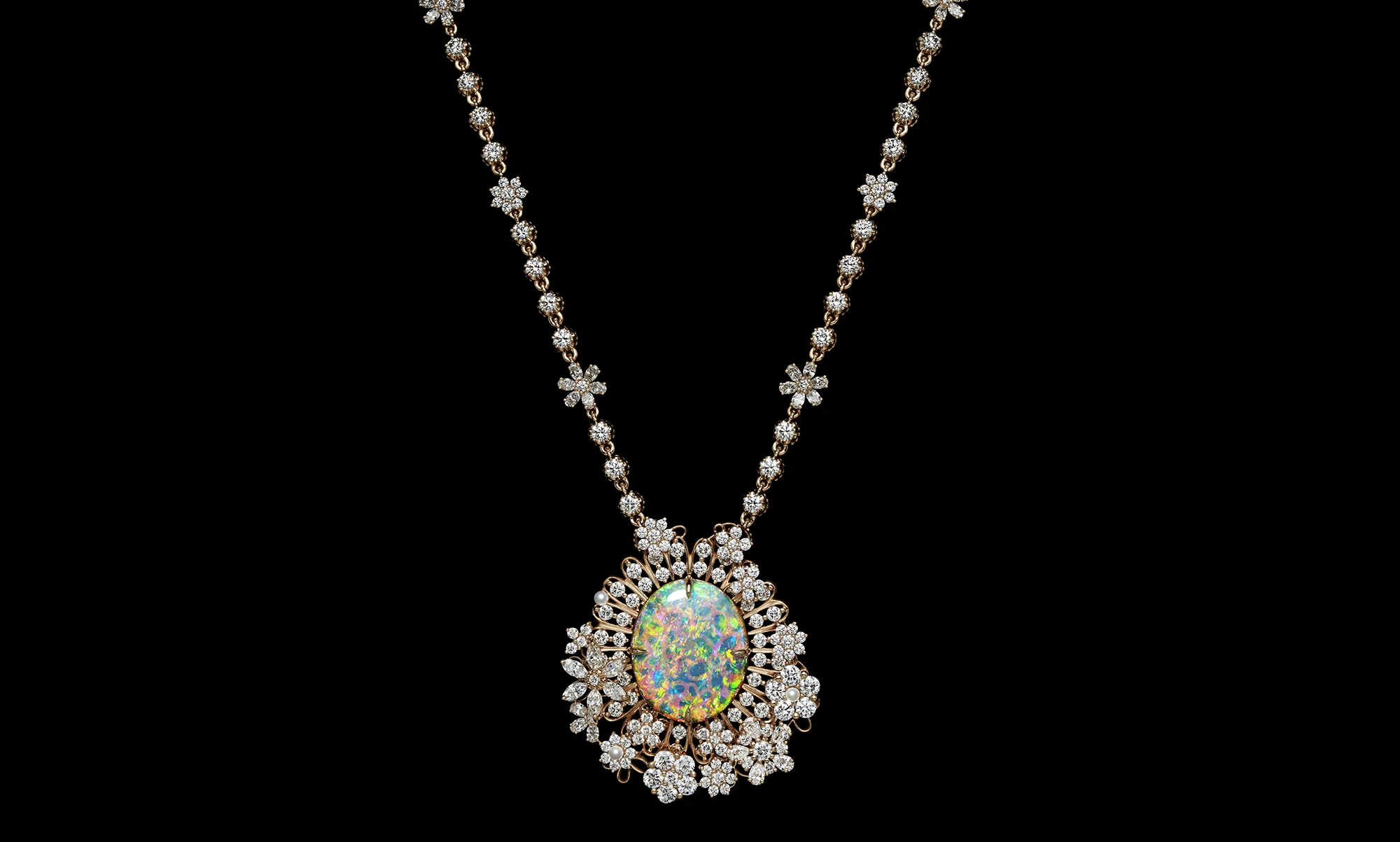 <p>A second pendant necklace set with an impressive oval-shaped precious opal, surrounded by micro-pearls and diamonds from the Dior Milly Dentelle High Jewellery collection </p>