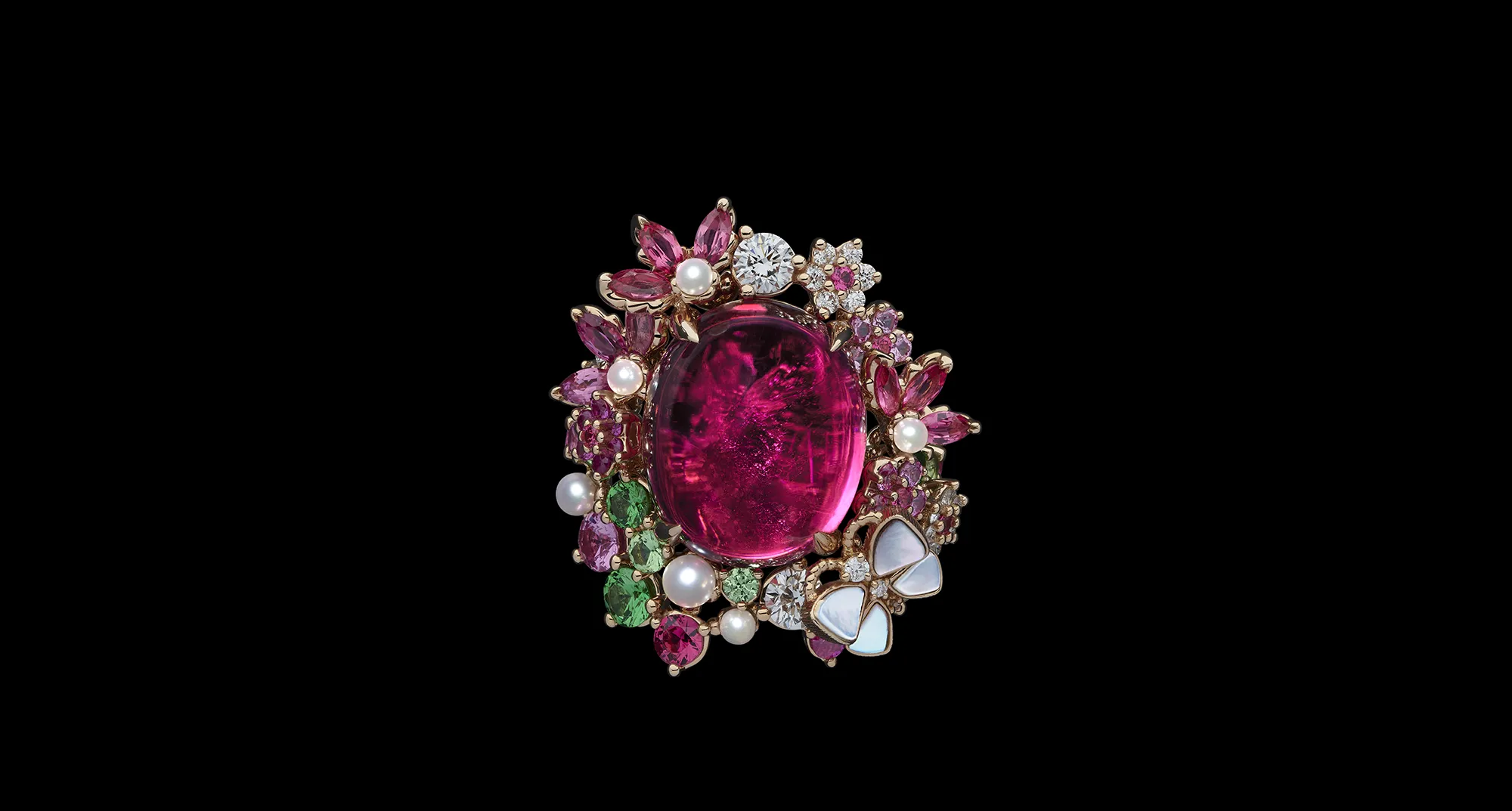 <p>The Dior Milly Dentelle High Jewellery collection features significant gemstones, including this large ruby cabochon surrounded by further rubies, pink sapphires, demantoid garnets, micro-pearls and mother of pearl inlay </p>