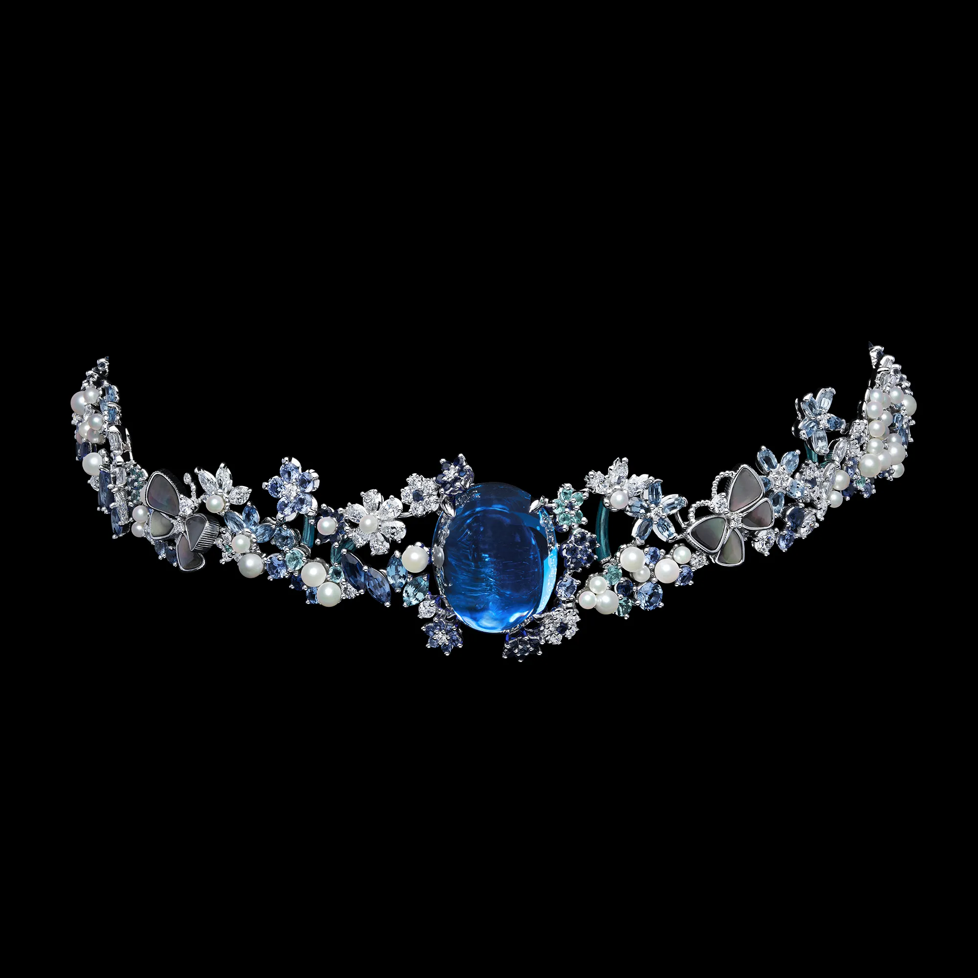 <p>A choker necklace from the Dior Milly Dentelle High Jewellery collection with a large sapphire cabochon, mother of pearl butterflies, pearls, marquise-shaped coloured stones and fancy-cut diamonds </p>