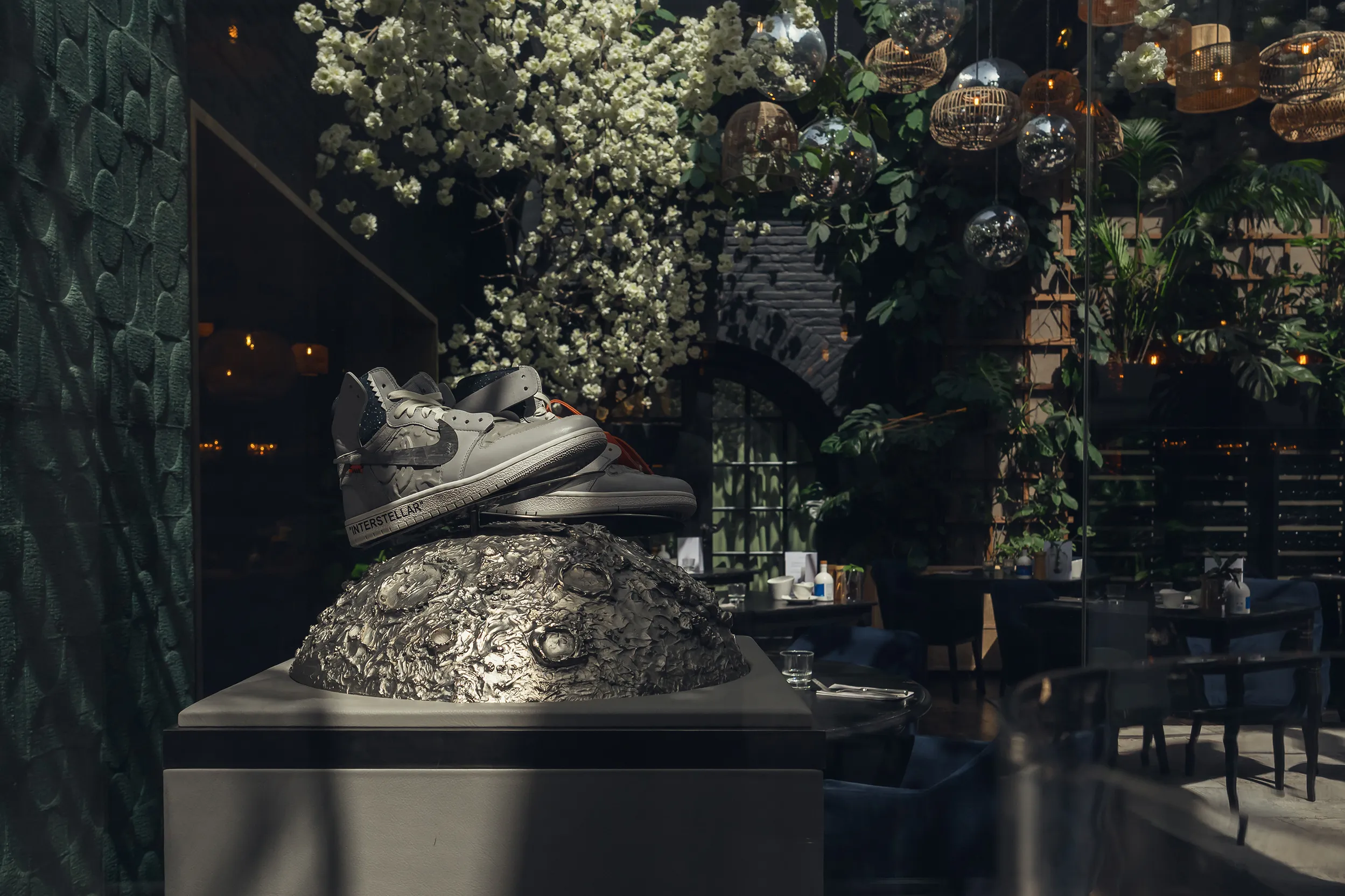 <p><em>Interstellar</em> by The Surgeon x Granada Gallery—a sculpture featuring a customised pair of Nike Off-Whites incorporating a 4.56 billion-year-old meteorite swoosh</p>
