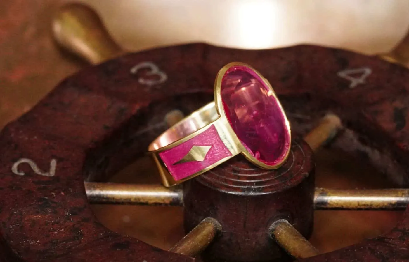 <p> Jogani handmade cigar band ring with a 2.14 carat oval-shaped portrait-cut pink Burmese sapphire and enameled shank in 18k gold</p>