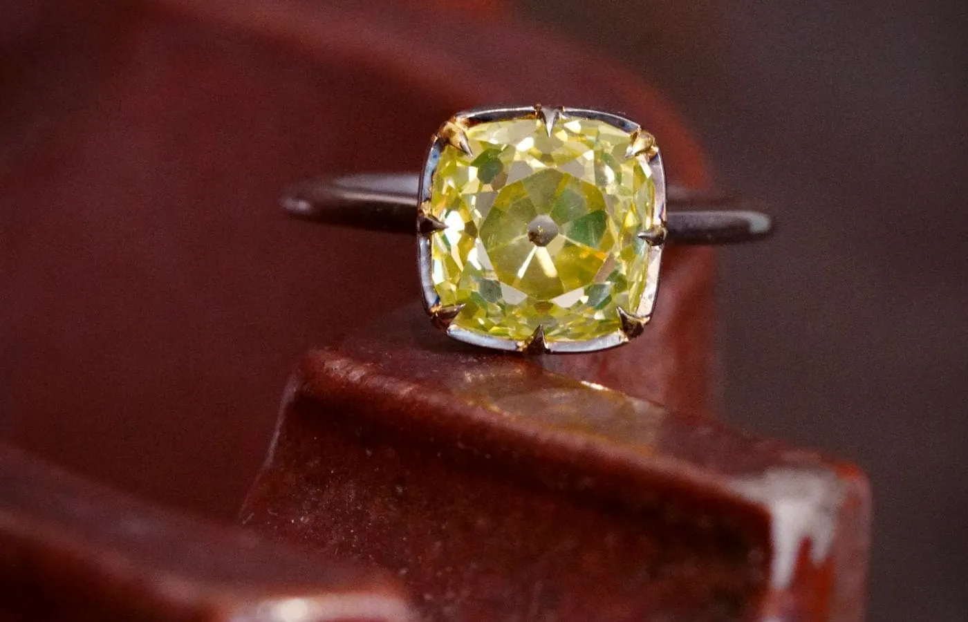 <p> Jogani ring with a 4.13 carat ‘lemon-lime’ natural fancy deep yellow diamond with an old mine cut, set in 18k gold </p>