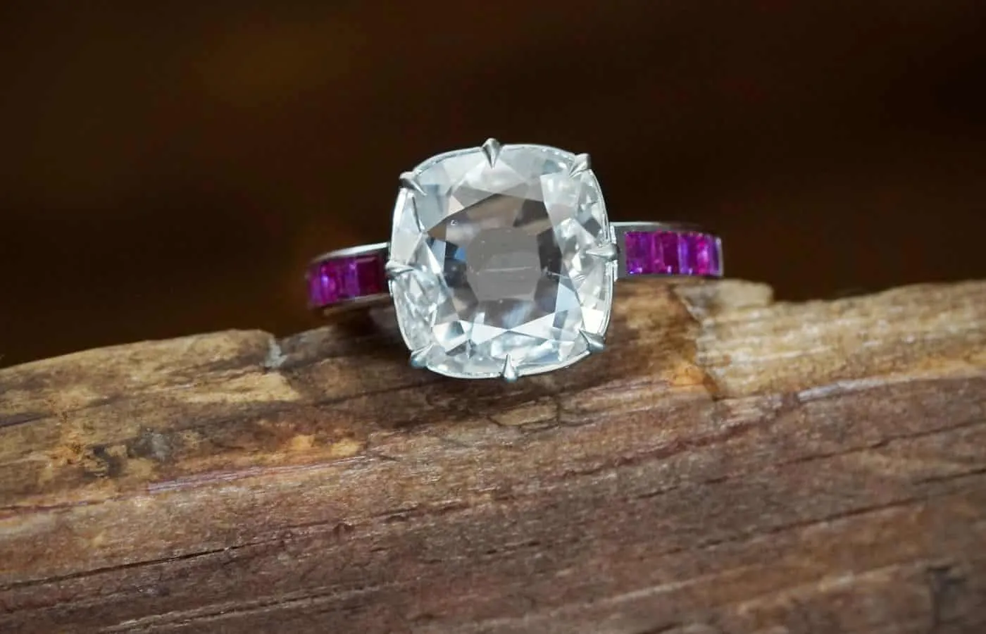 <p> Jogani Victorian-inspired ring with a 3 carat flat cushion-cut diamond and unheated Burmese rubies in platinum </p>