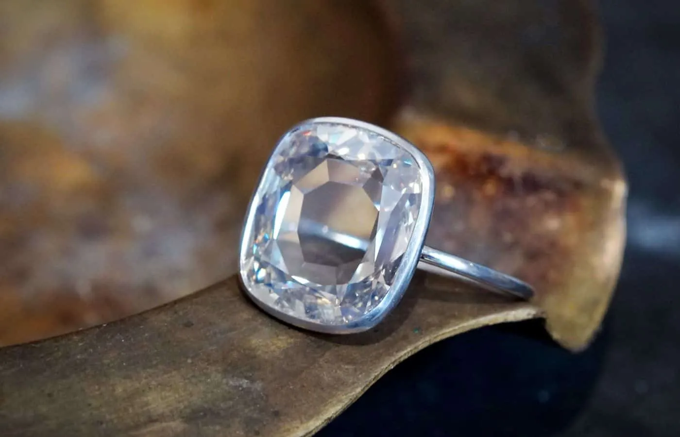 <p> Jogani ring with a 4.06 carat flat cushion-cut diamond set in platinum </p>