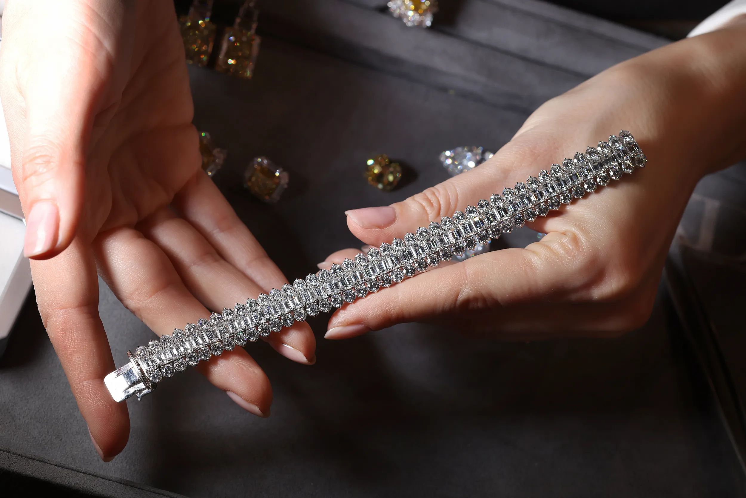 <p>An emerald cut and round diamond high jewellery bracelet by Julius Klein</p>
