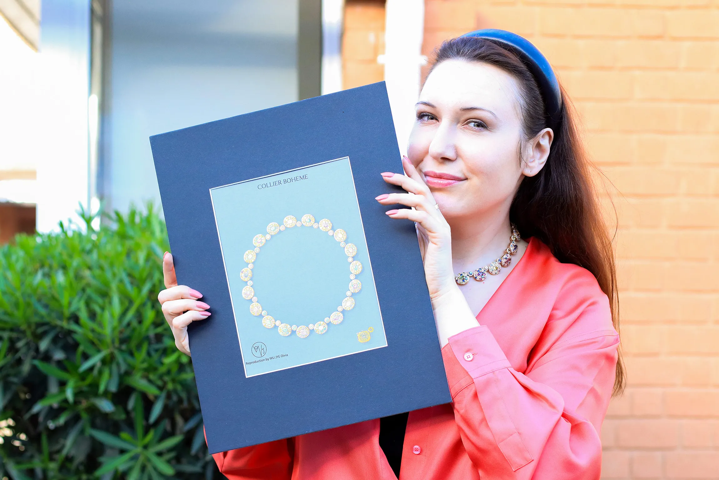 <p>Katerina Perez holds a gouache painting of the Morebelli Collier Bohème – a masterpiece necklace created to celebrate the brand’s 10th anniversary in 2022</p>