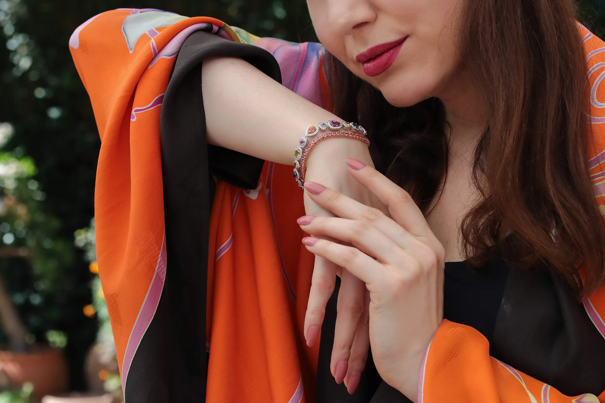 <p>Katerina Perez wears a Morebelli bracelet with 14.21 carats of sapphires and tsavorites, all mined in Madagascar, set alongside 353 G/VS1 diamonds weighing 1.65 carats in 18k white gold </p>