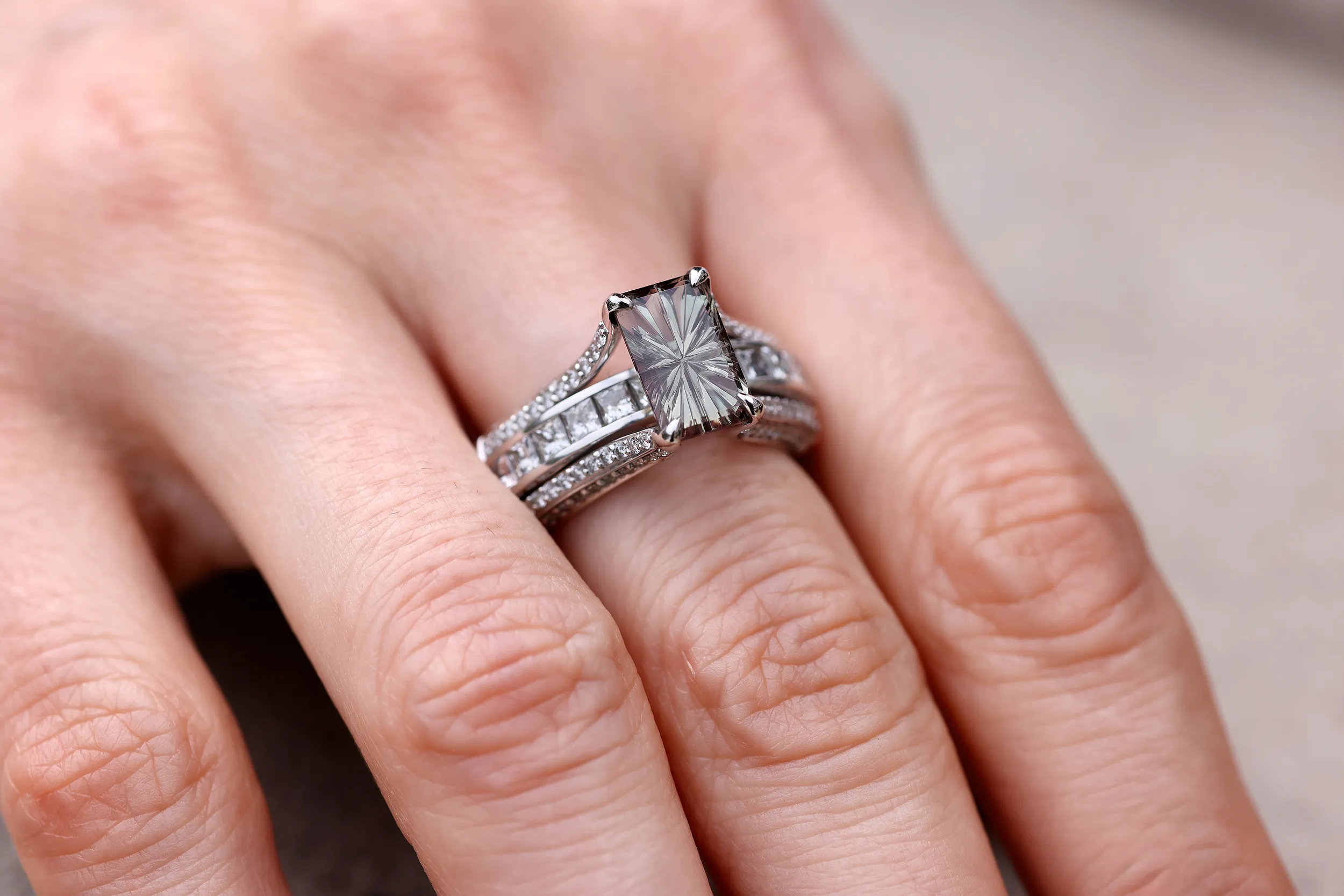 Katerina Perez and Amit Bhansali, founder of Chromia_The centre 2.15ct emerald cut colour-change Oregon garnet was shaped by master cutter John Dyer into the Oregon Sunstone Starbrite cut