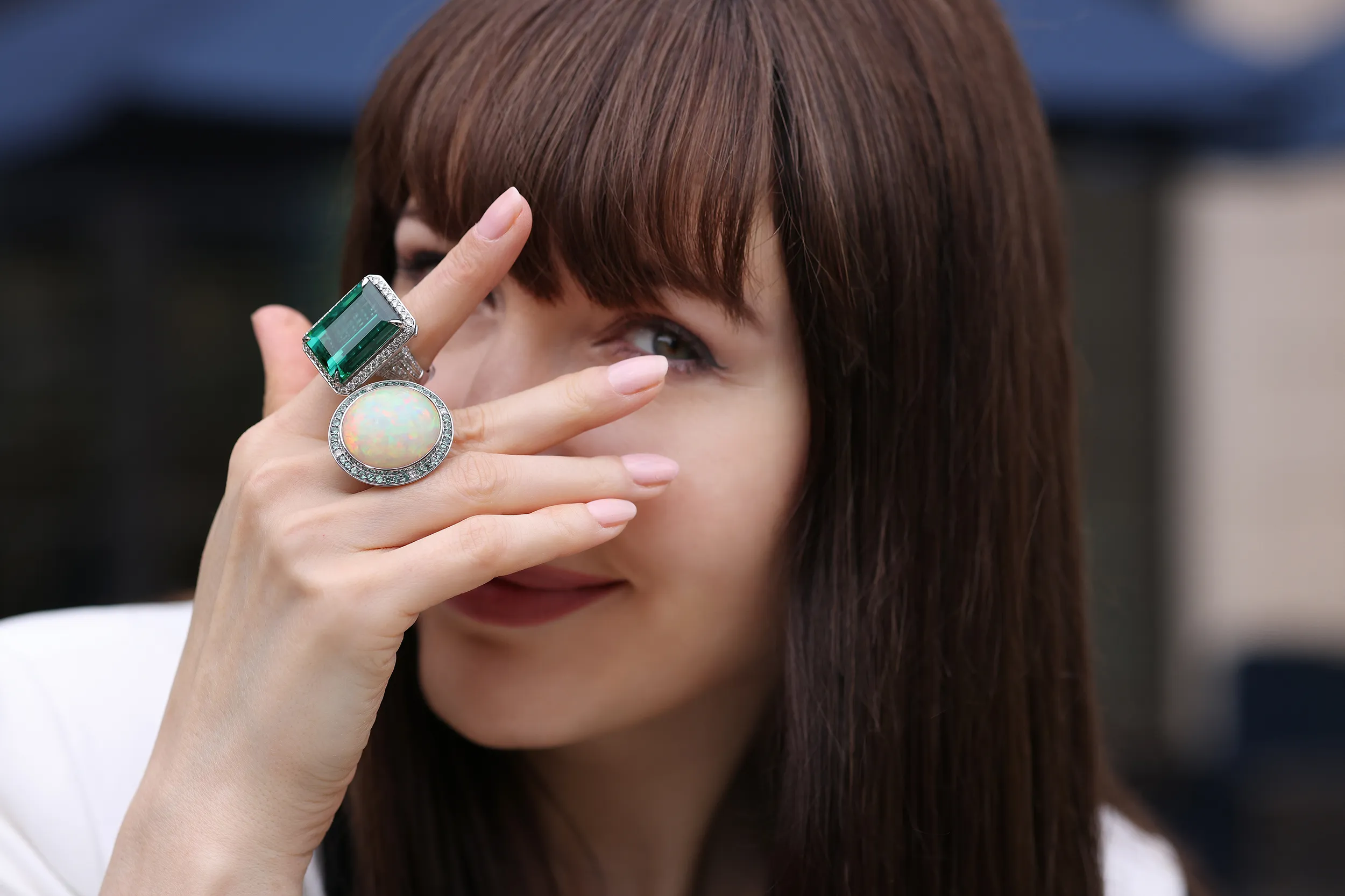 <p>39.21ct emerald cut titanium tourmaline ring with diamonds in 18k white gold and a 30.29ct oval Orion Opal cabochon ring with Alexandrites and diamonds in 18k white gold</p>
