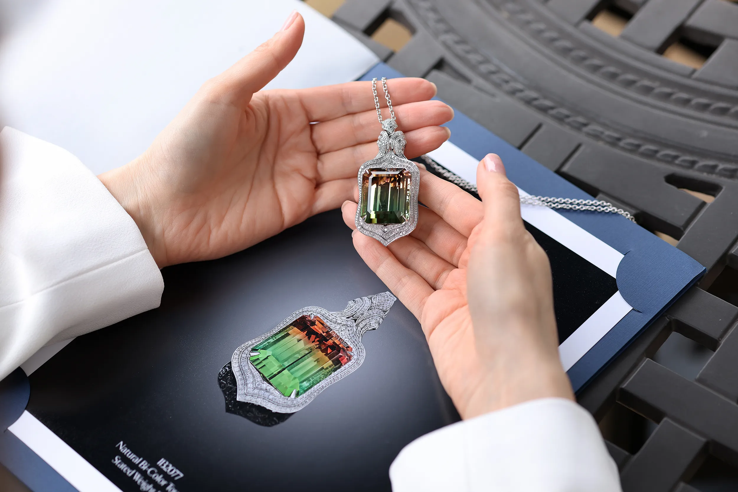 <p>The emerald cut creates a window into the 130.70ct bi-colour tourmaline, highlighting its unique gradation of colours</p>
