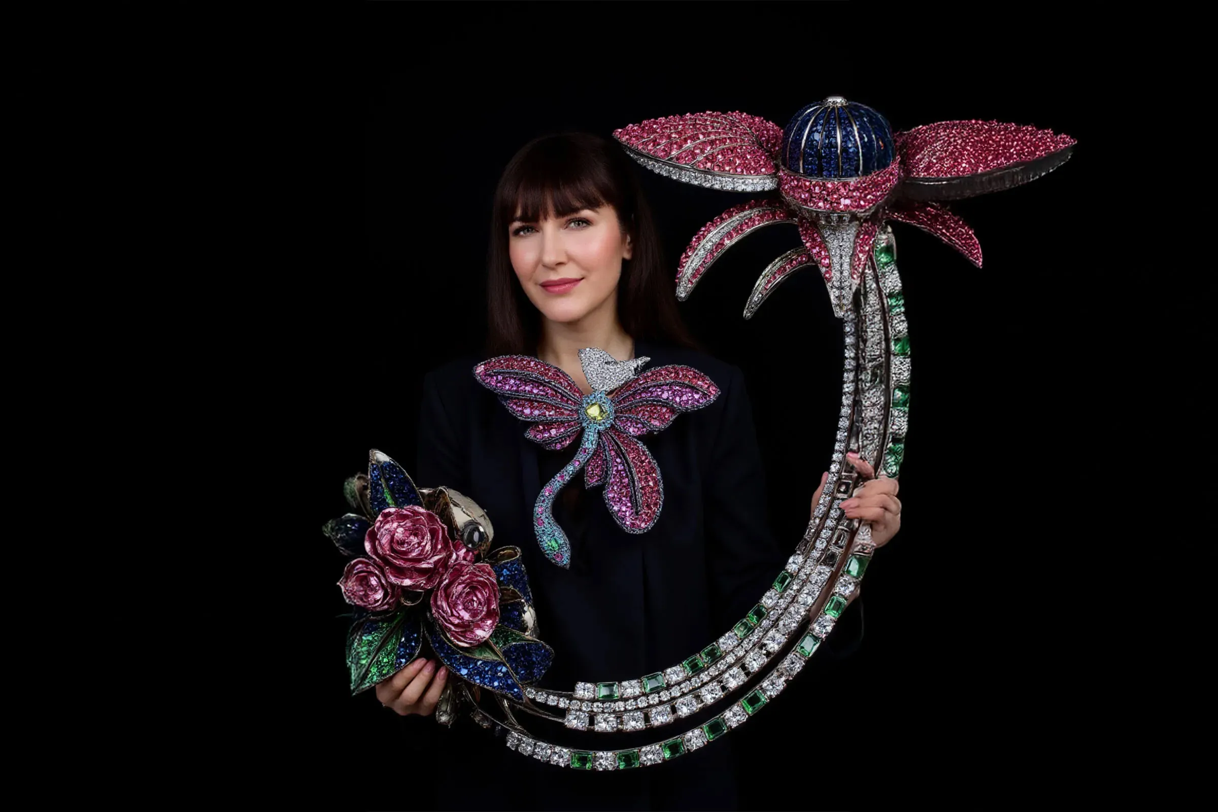 <p>Katerina Perez is shown interacting with a super-sized sculpture of diamonds and precious gemstones, imagined by AI artist Anastasia Rogozhina</p>
