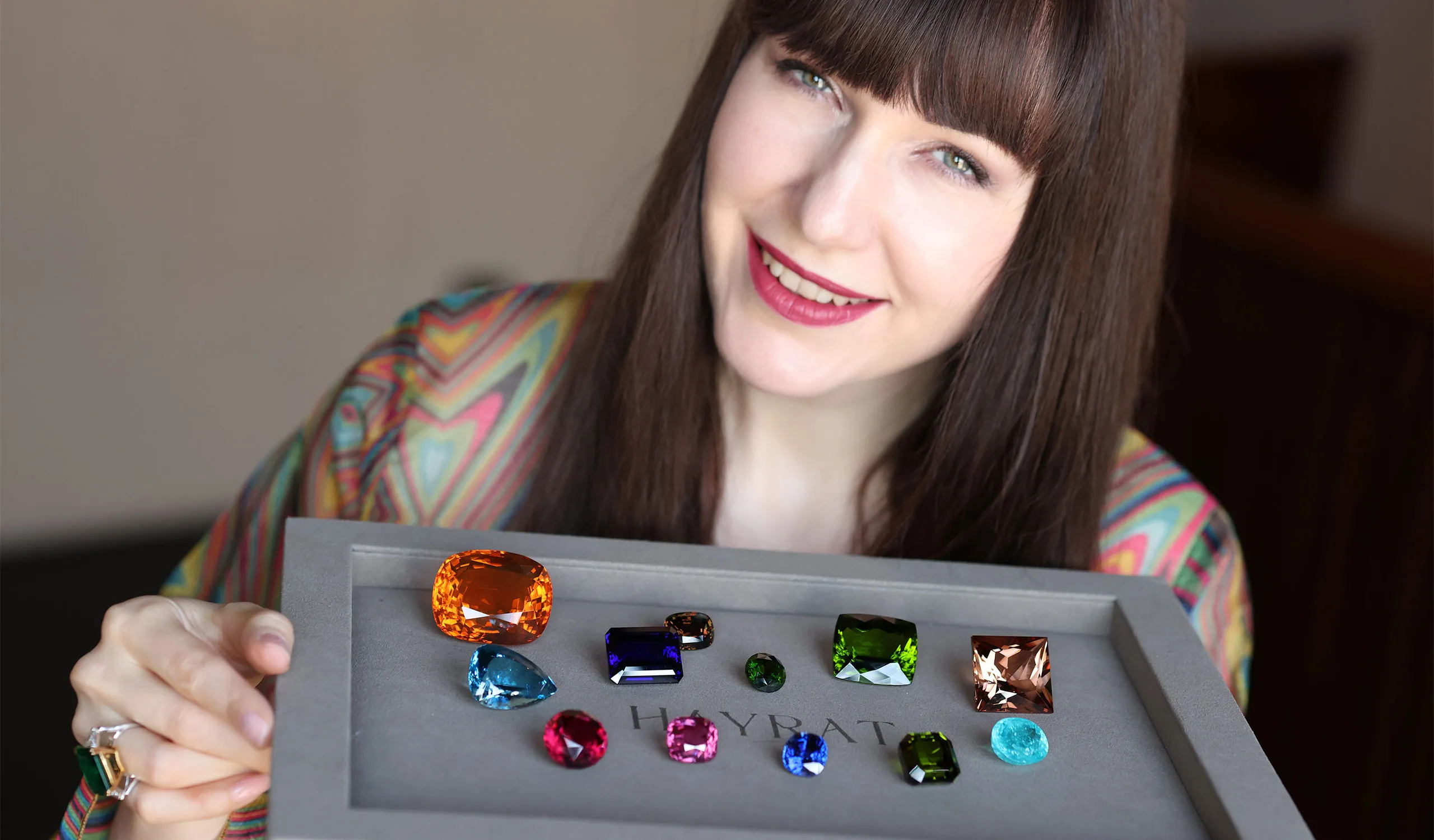 <p>Katerina Perez explores a colourful selection of large gemstones at Hayrat Fine Gems in Dubai</p>
