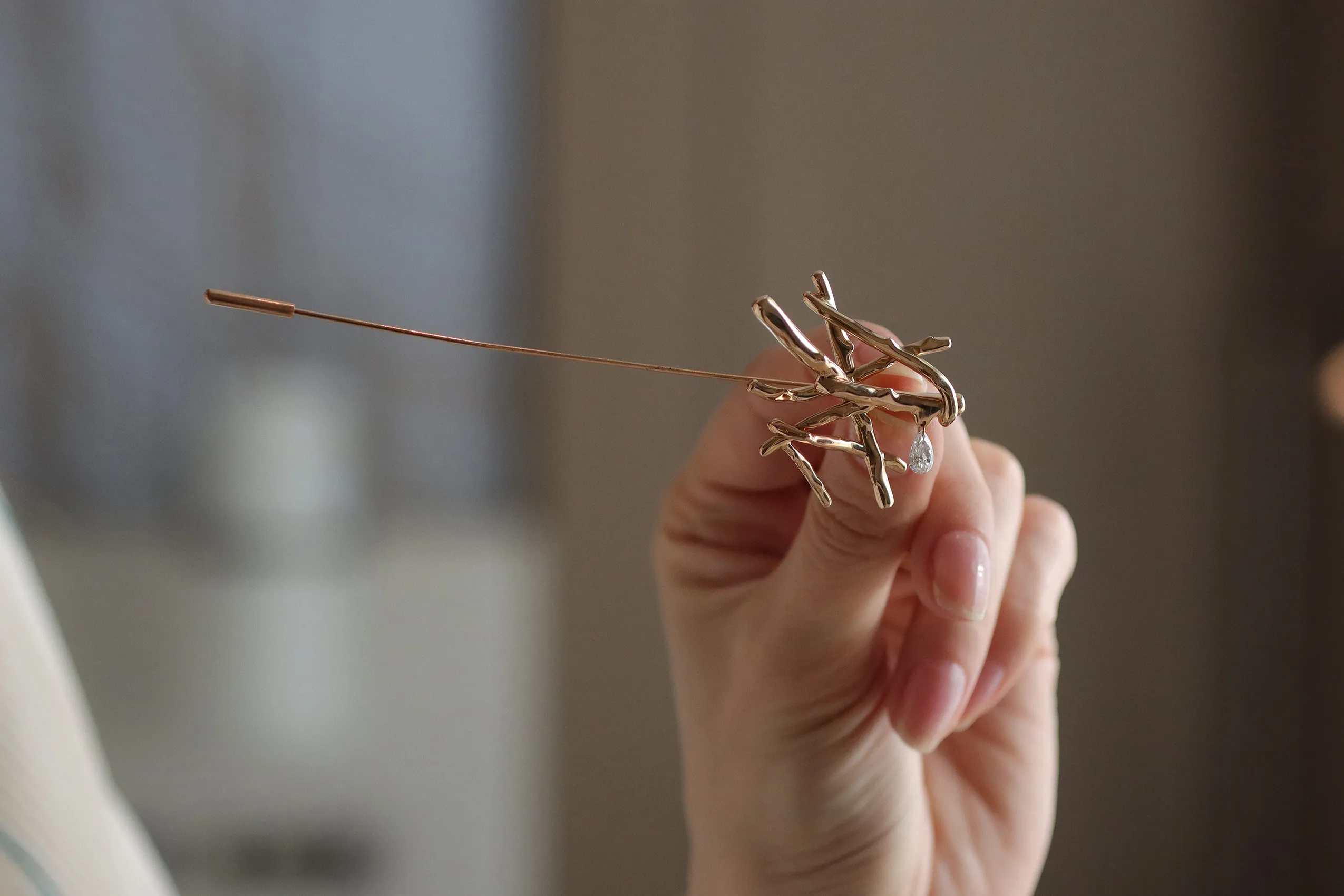 <p>cKefah brooch in 18k yellow gold with a pear shape diamond by Moody Jewellery</p>