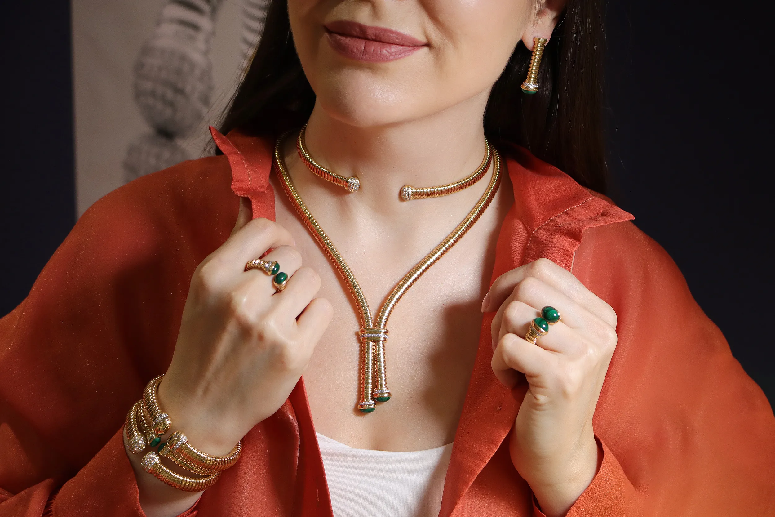 <p>Katerina Perez wears a full suite of Tourbillon collection jewels by HIMO Jewellery, including a choker, lariat necklace, rings, earrings and matching bracelets crafted in 18k yellow gold, diamonds and hardstones</p>