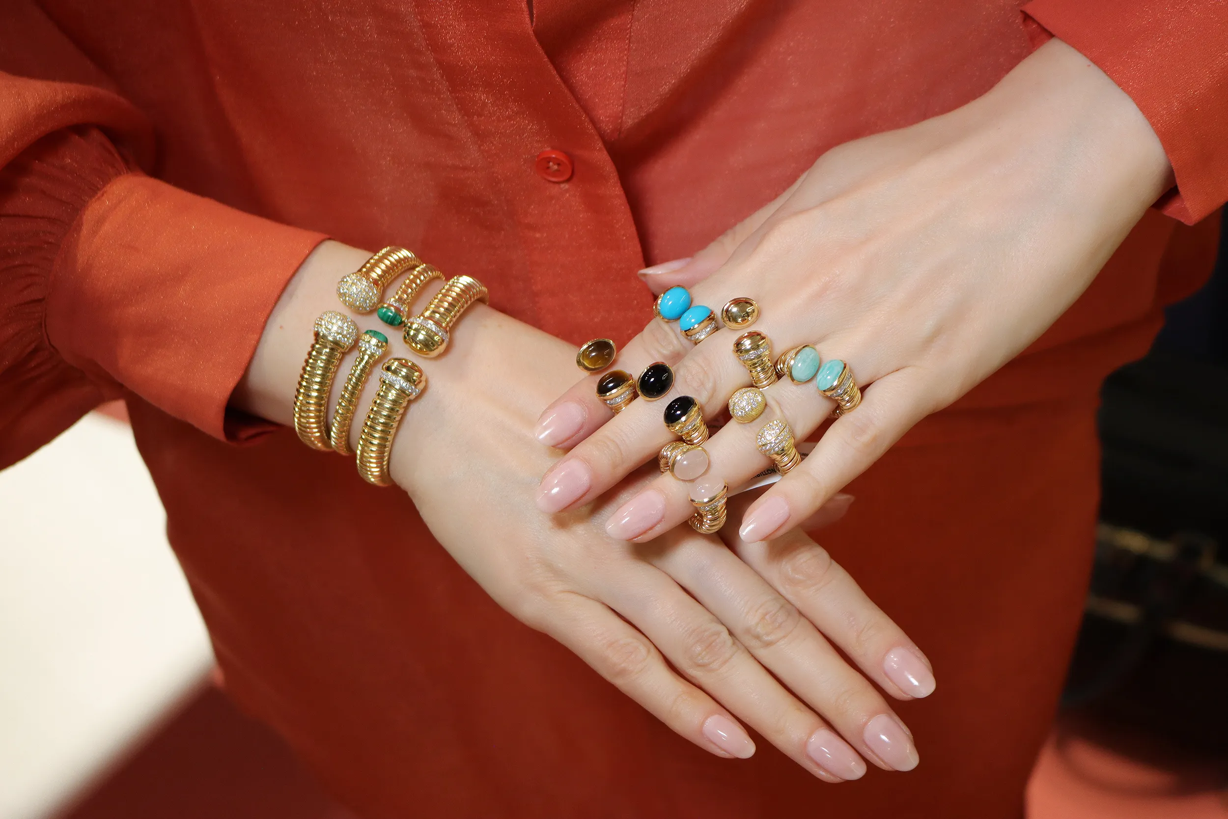 <p>Showcasing the colourful variations and widths of the HIMO Jewellery Tourbillon collection bracelets and rings, set with diamonds and hardstones like malachite, tiger’s eye, onyx, and turquoise</p>