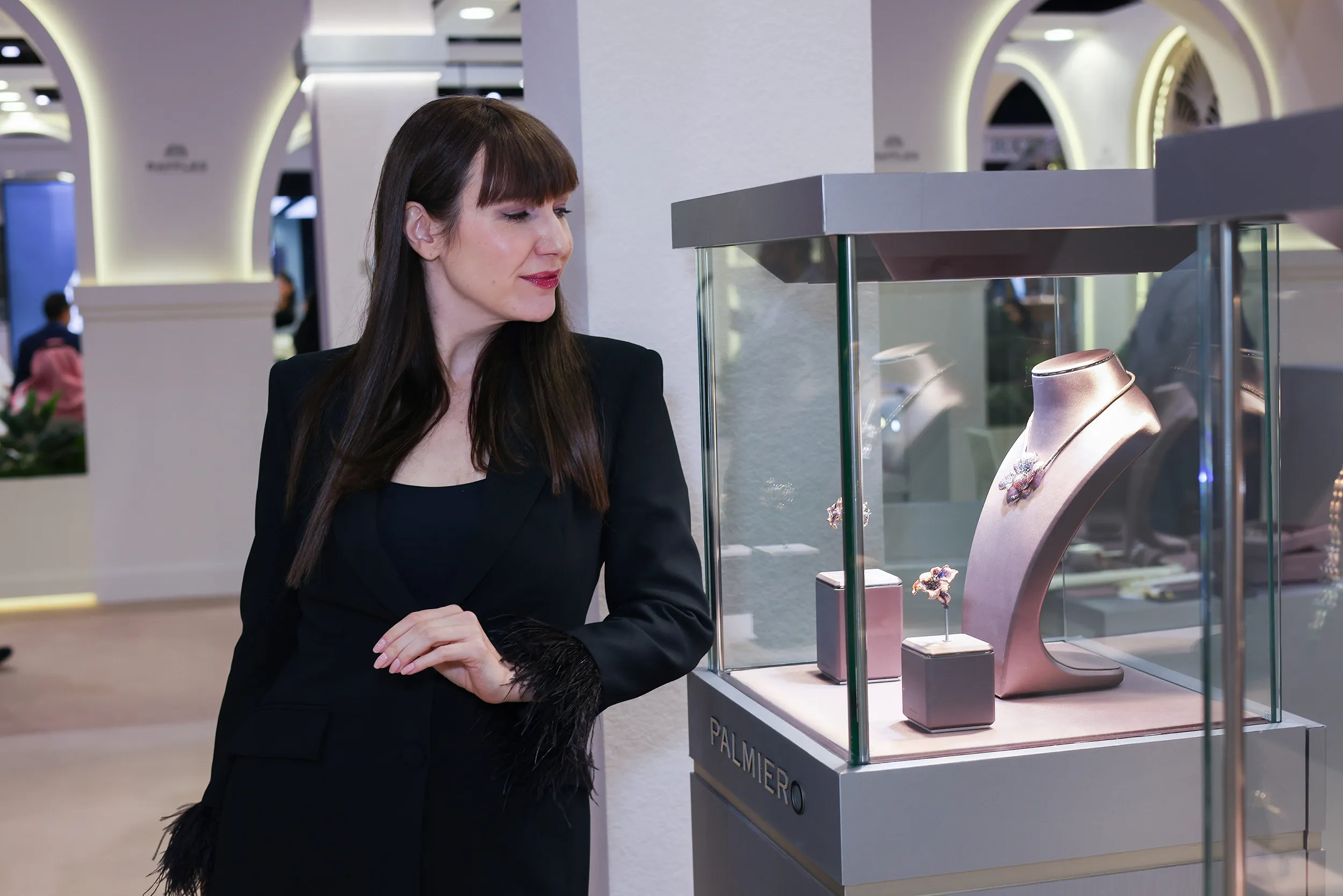 <p>Katerina admiring the jewels on display at Palmiero</p>
