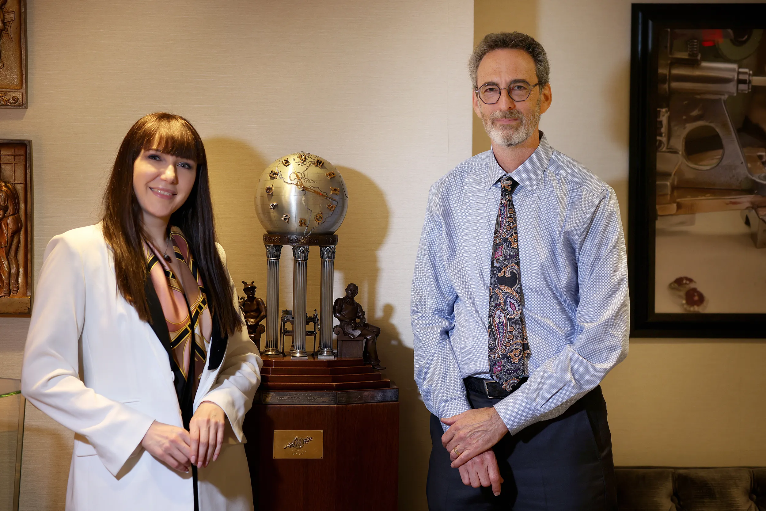 <p>Katerina and Tom Heyman with a clock made by the employees celebrating the firm’s 25<sup>th</sup> anniversary in 1937</p>
