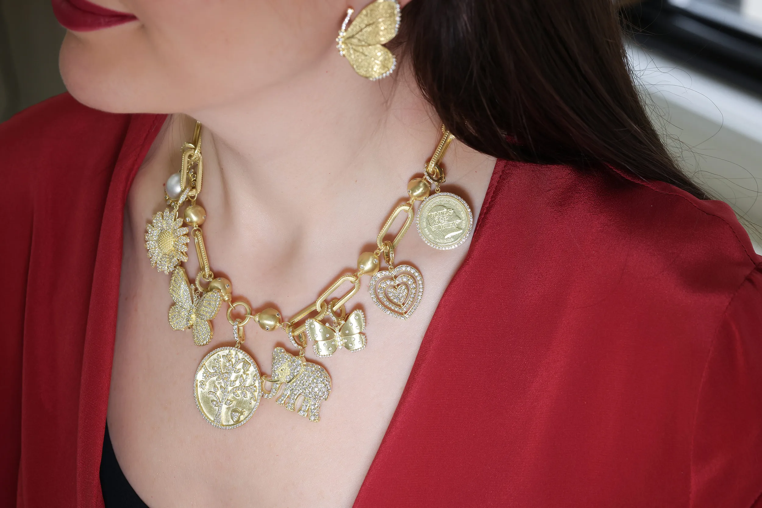 <p>Katerina Perez wears the Tanya Farah Fine Jewelry ‘build your own’ charm necklace set with diamonds in 18k yellow gold</p>