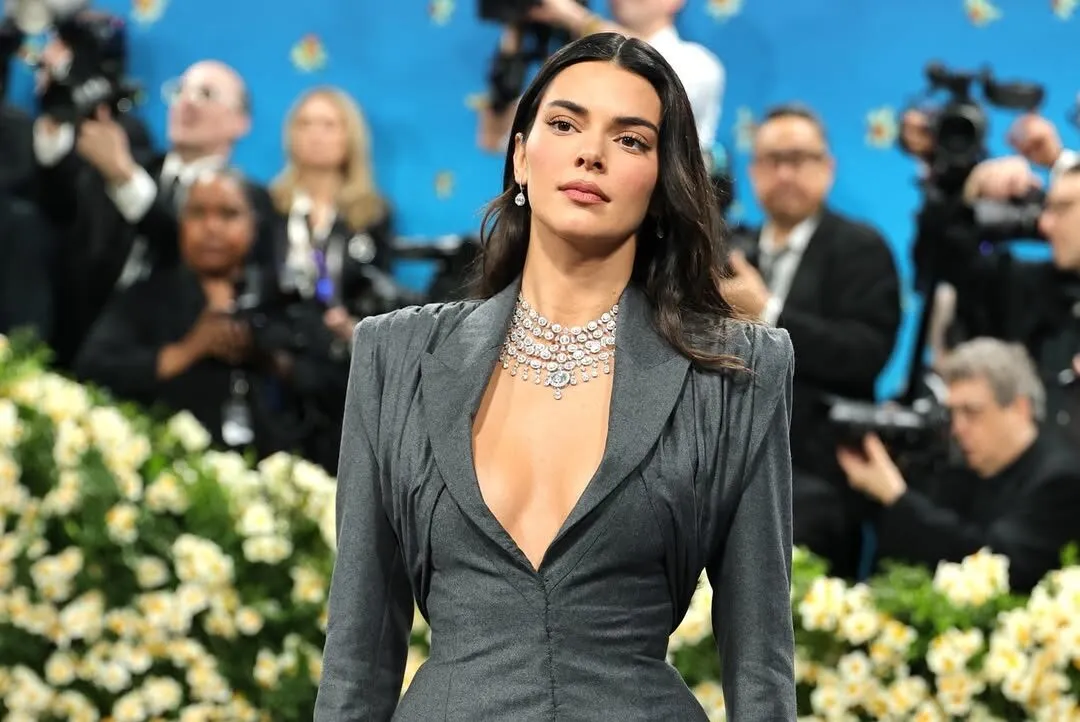 <p>Kendall Jenner paired her plunging suit with a Chopard high jewellery necklace, set with a 12.37-carat diamond solitaire</p>
