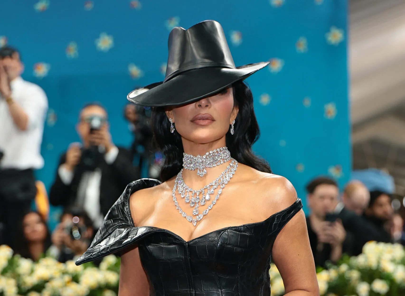 <p>Kim Kardashian piled on the diamonds: a choker, fringe necklace and aline necklace with matching diamond earrings and ring by Moussaieff</p>
